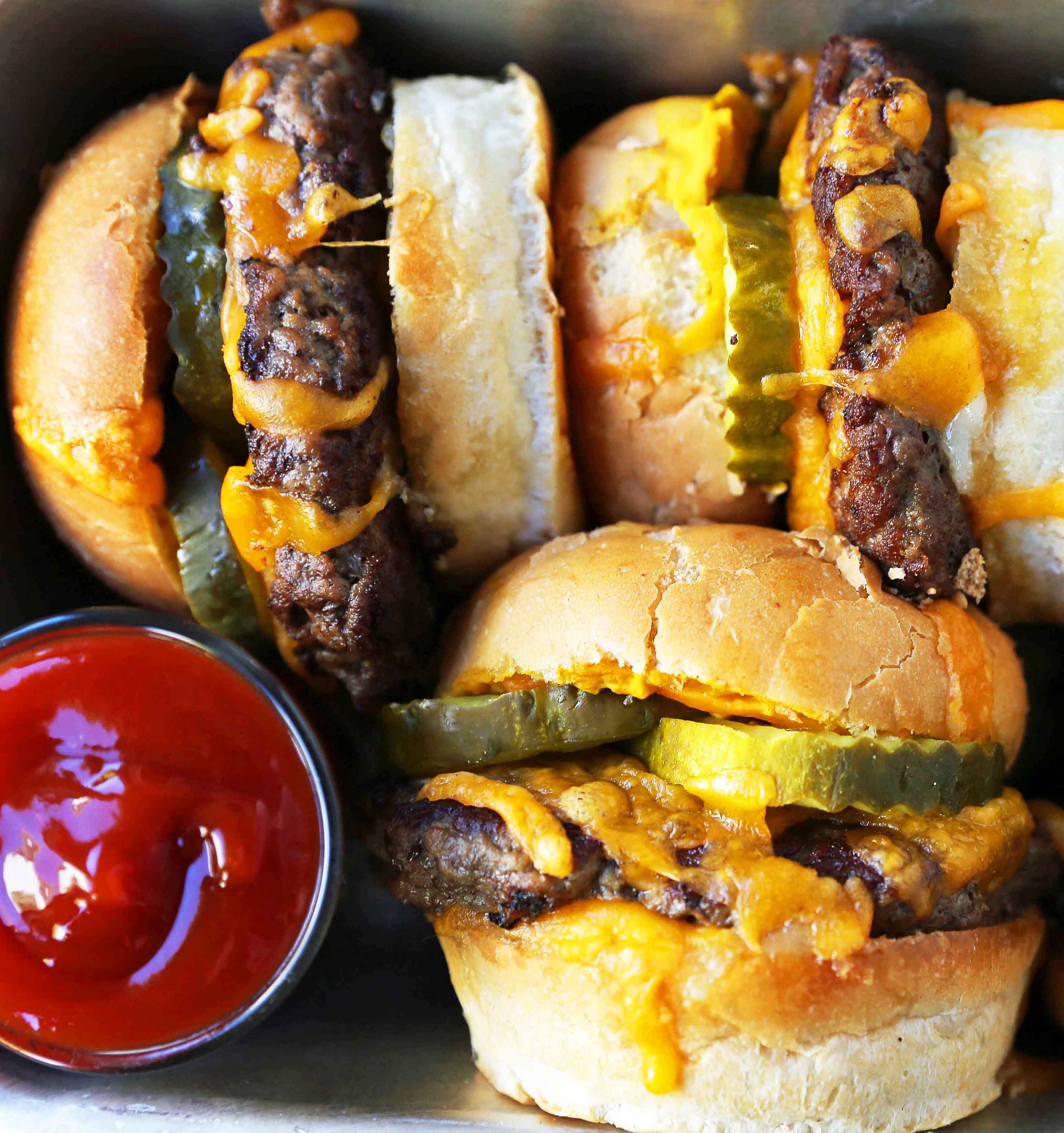 Cheeseburger Sliders. How to make the perfect cheese sliders. Super Bowl food. www.modernhoney.com #sliders #cheeseburgers #hamburgers #burgers #burger