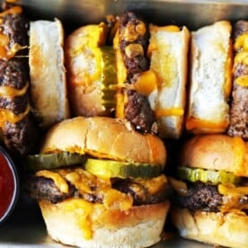 Cheeseburger Sliders. How to make the perfect cheese sliders. Super Bowl food. www.modernhoney.com #sliders #cheeseburgers #hamburgers #burgers #burger