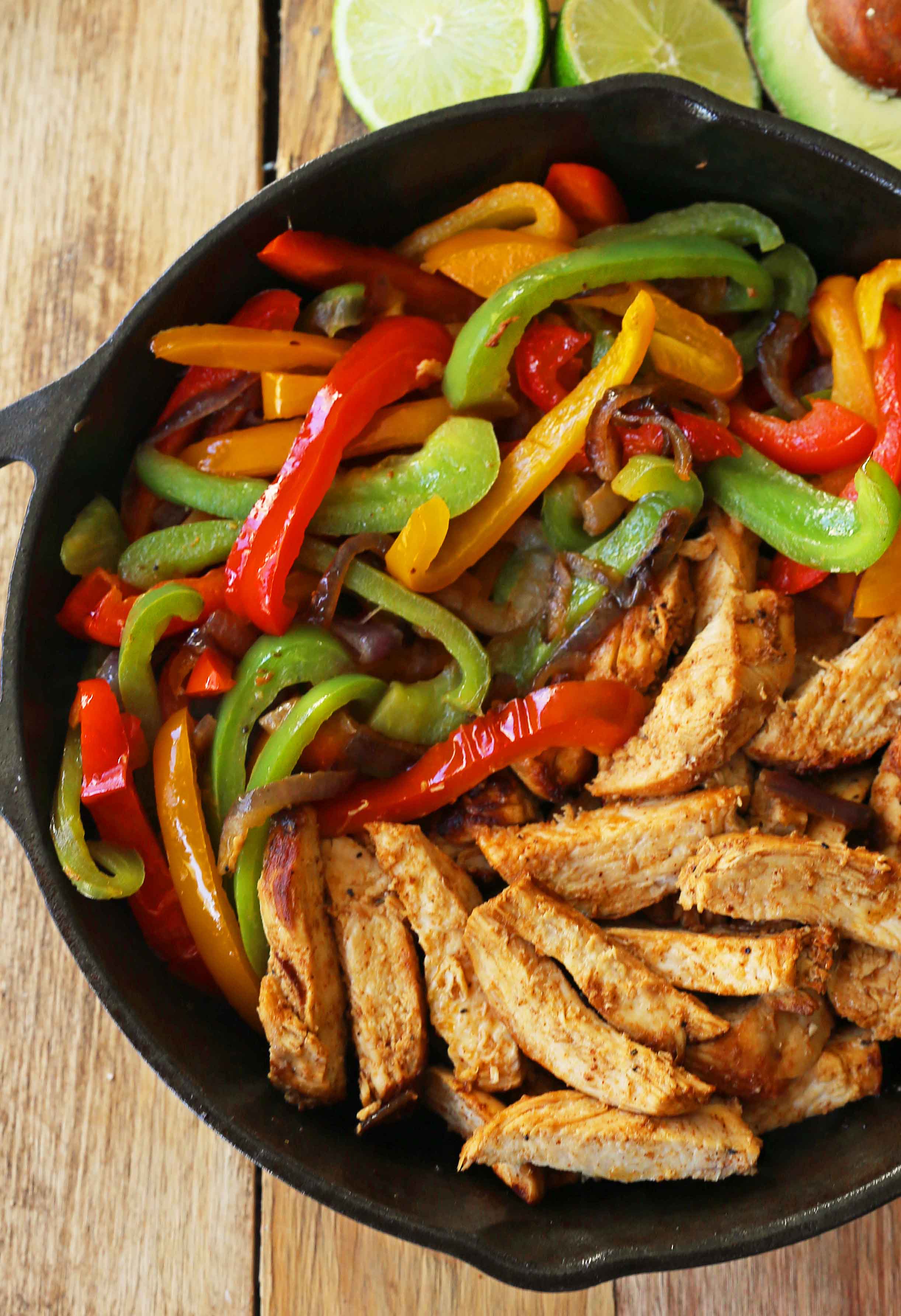 The Best Chicken Fajitas Recipe. Flavorful, juicy, seasoned chicken fajitas with sauteed onions and peppers.  The perfect chicken fajitas recipe! www.modernhoney.com #chicken #chickenfajitas #fajitas #mexican #mexicanfood 