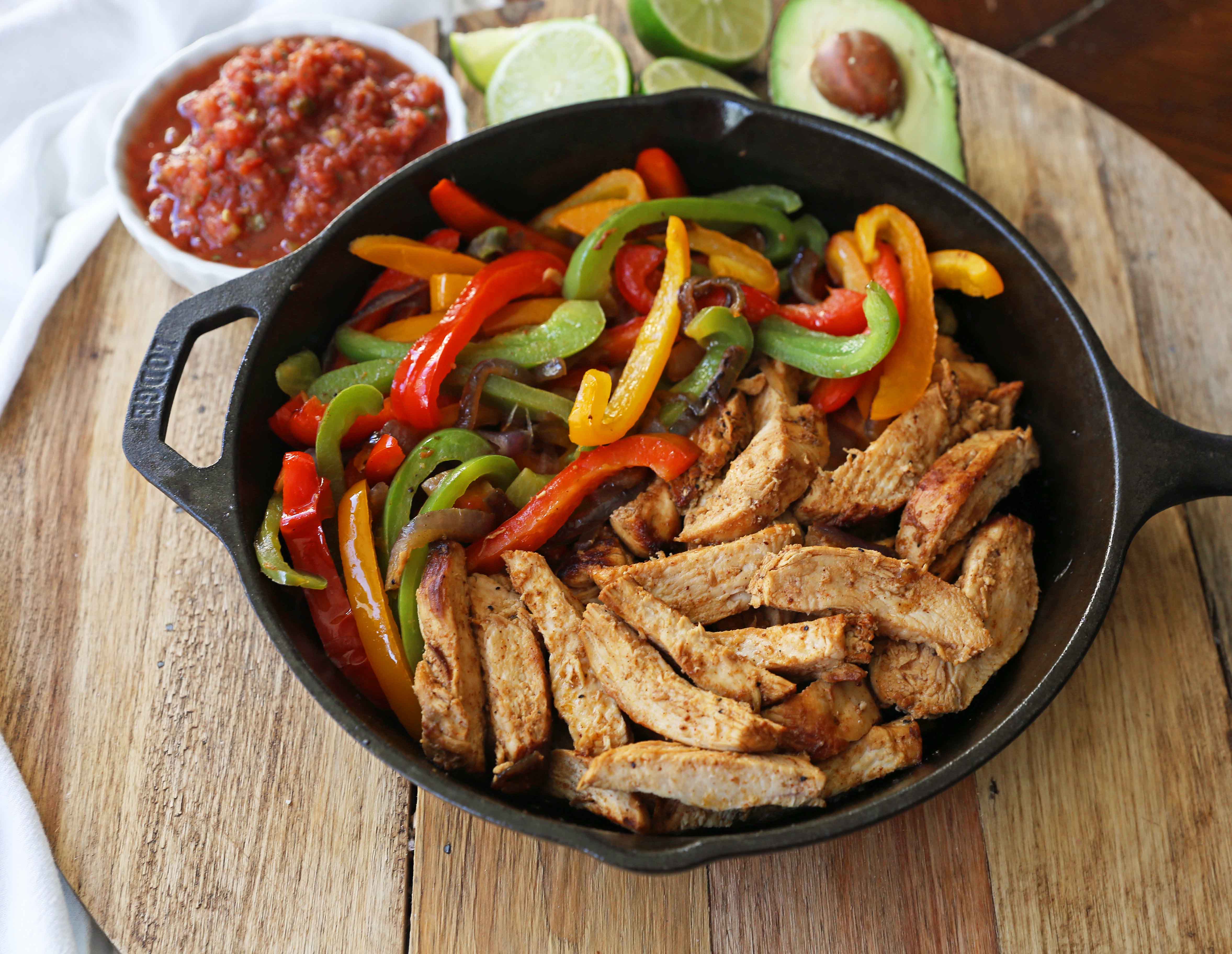 The Best Chicken Fajitas Recipe. Flavorful, juicy, seasoned chicken fajitas with sauteed onions and peppers.  The perfect chicken fajitas recipe! www.modernhoney.com #chicken #chickenfajitas #fajitas #mexican #mexicanfood 