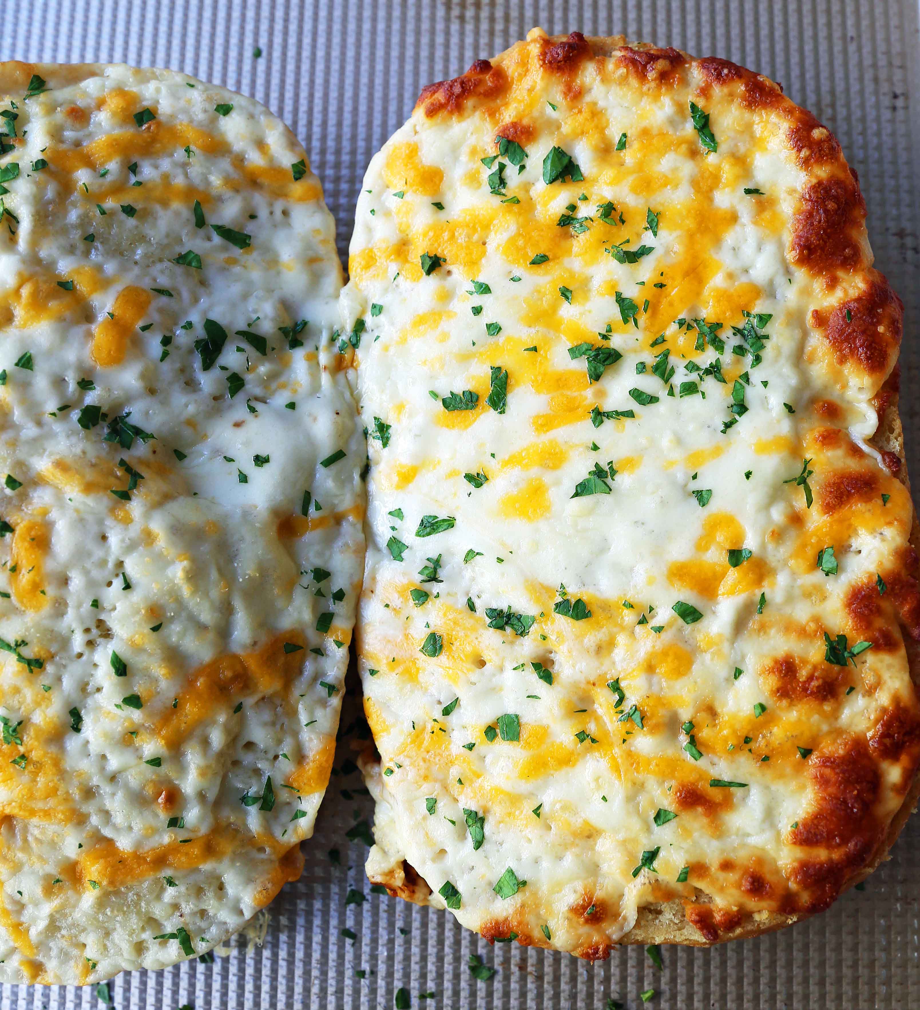 Quick and Easy Garlic Cheese Bread. Warm bread toasted and slathered with garlic butter and melted ooey gooey cheese. Garlic Cheese Bread is the perfect side dish or appetizer. www.modernhoney.com #appetizer #sidedish #garlicbread #garliccheesebread #cheesebread