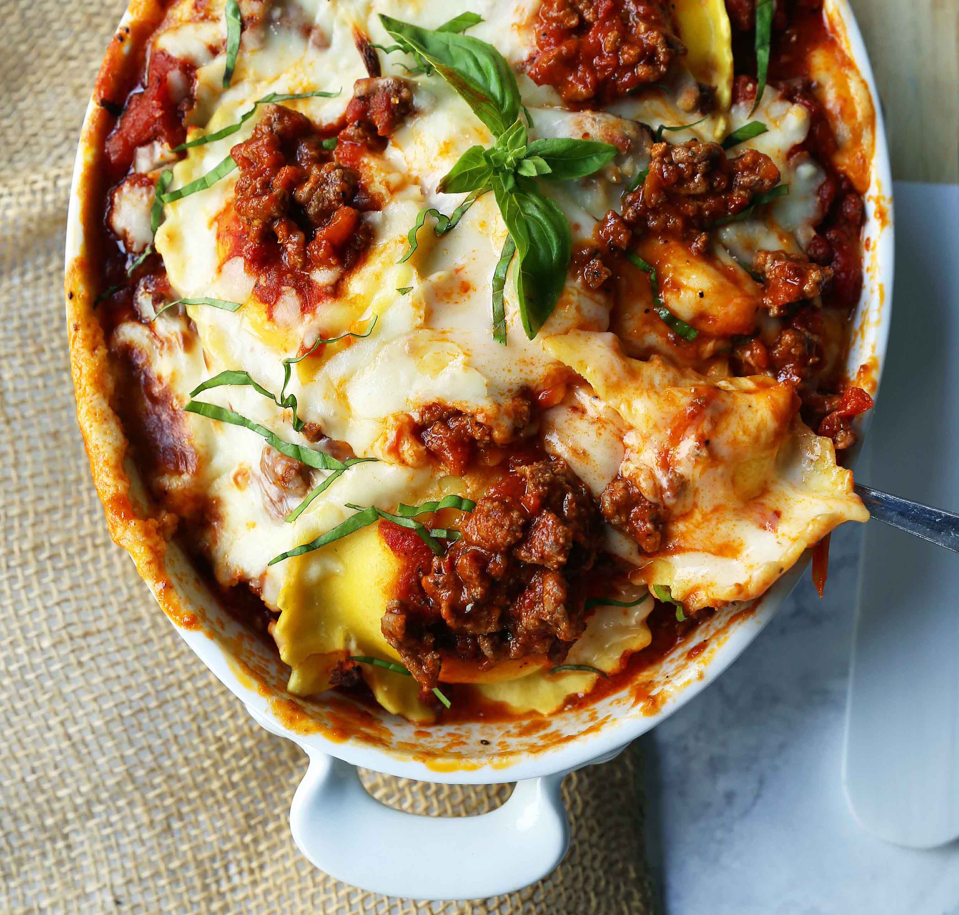 Ravioli Lasagna. Quick and Easy Lasagna Recipe made with cheese ravioli, meat sauce, and melted mozzarella cheese. How to make the best ravioli lasagna. www.modernhoney.com #lasagna #italian #italianfood #ravioli #dinner #dinnerrecipe 