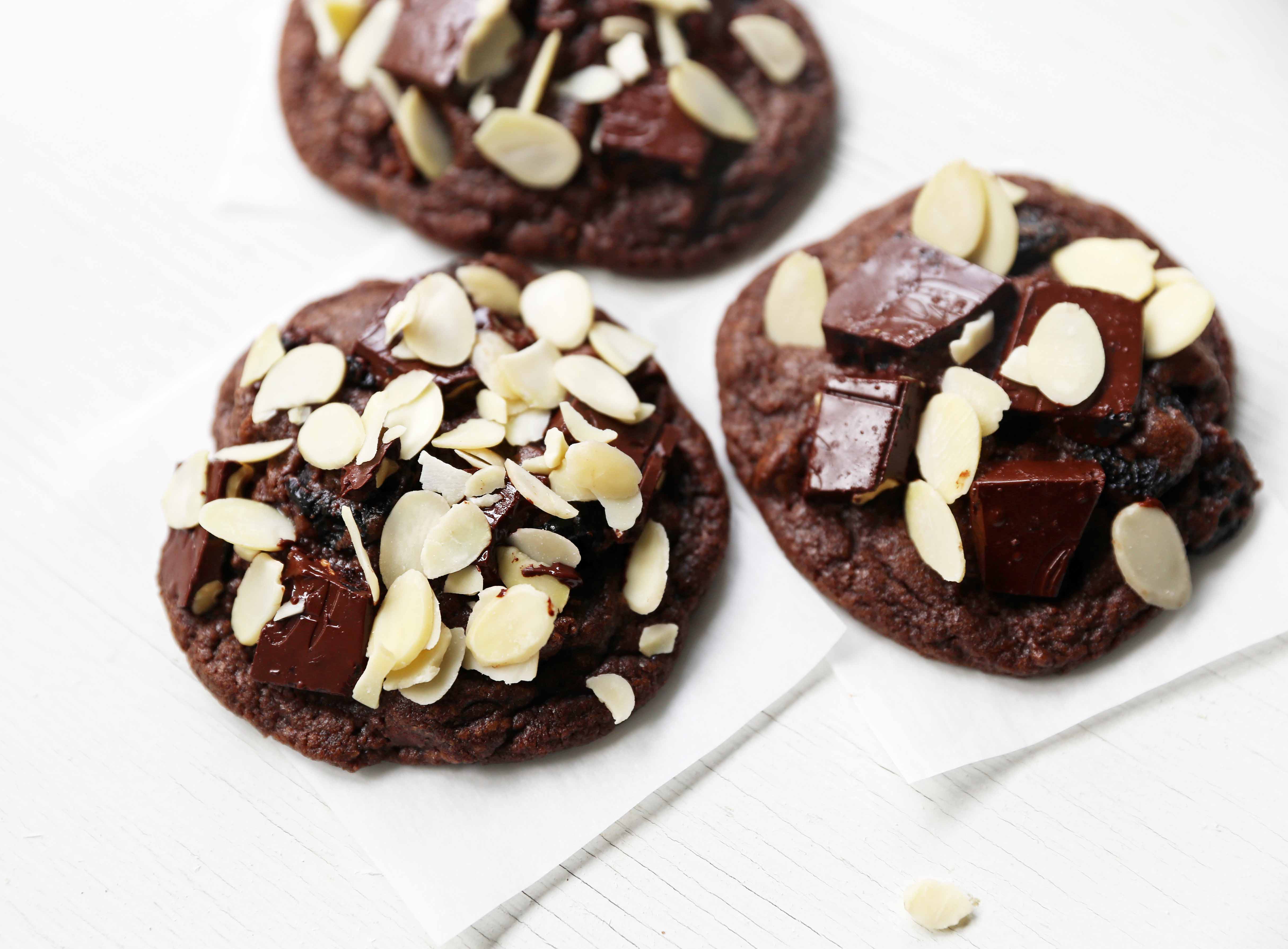 Chocolate Cherry Almond Cookies. Decadent chocolate chunk cookies with dried cherries and sliced almonds. A rich chocolate cherry chunk cookie! www.modernhoney.com #cherrychocolatecookies #chocolatecherrycookies #chocolatecookies #chocolatecookie 