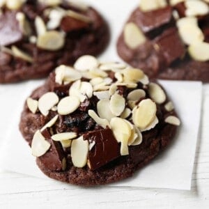 Chocolate Cherry Almond Cookies. Decadent chocolate chunk cookies with dried cherries and sliced almonds. A rich chocolate cherry chunk cookie! www.modernhoney.com #cherrychocolatecookies #chocolatecherrycookies #chocolatecookies #chocolatecookie