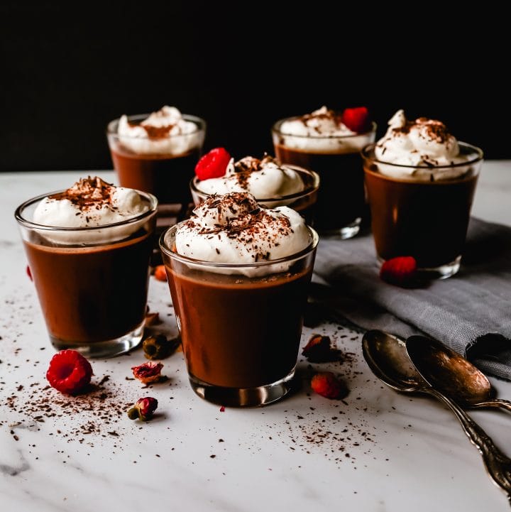 Chocolate Pot de Creme. Rich velvety smooth chocolate custard topped with fresh whipped cream. A pot of cream made with melted chocolate, heavy cream, sugar, and egg yolks. A decadent chocolate dessert!