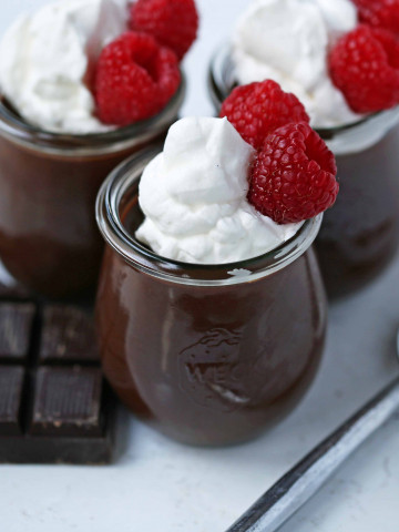 Chocolate Pot de Creme. Rich velvety smooth chocolate custard topped with fresh whipped cream. A pot of cream made with melted chocolate, heavy cream, sugar, and egg yolks. A decadent chocolate dessert! www,modernhoney.com #chocolatedessert #chocolatepotdecreme #potdecreme #valentinesday #chocolate