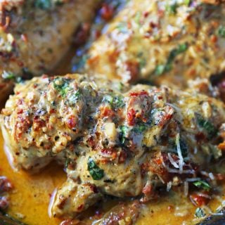 Marry Me Chicken. Famous skillet chicken in a sundried tomato parmesan cream sauce with fresh basil. It will definitely inspire marriage proposals! www.modernhoney.com #chicken #skilletchicken #marrymechicken #30minutemeal #30minutemeals