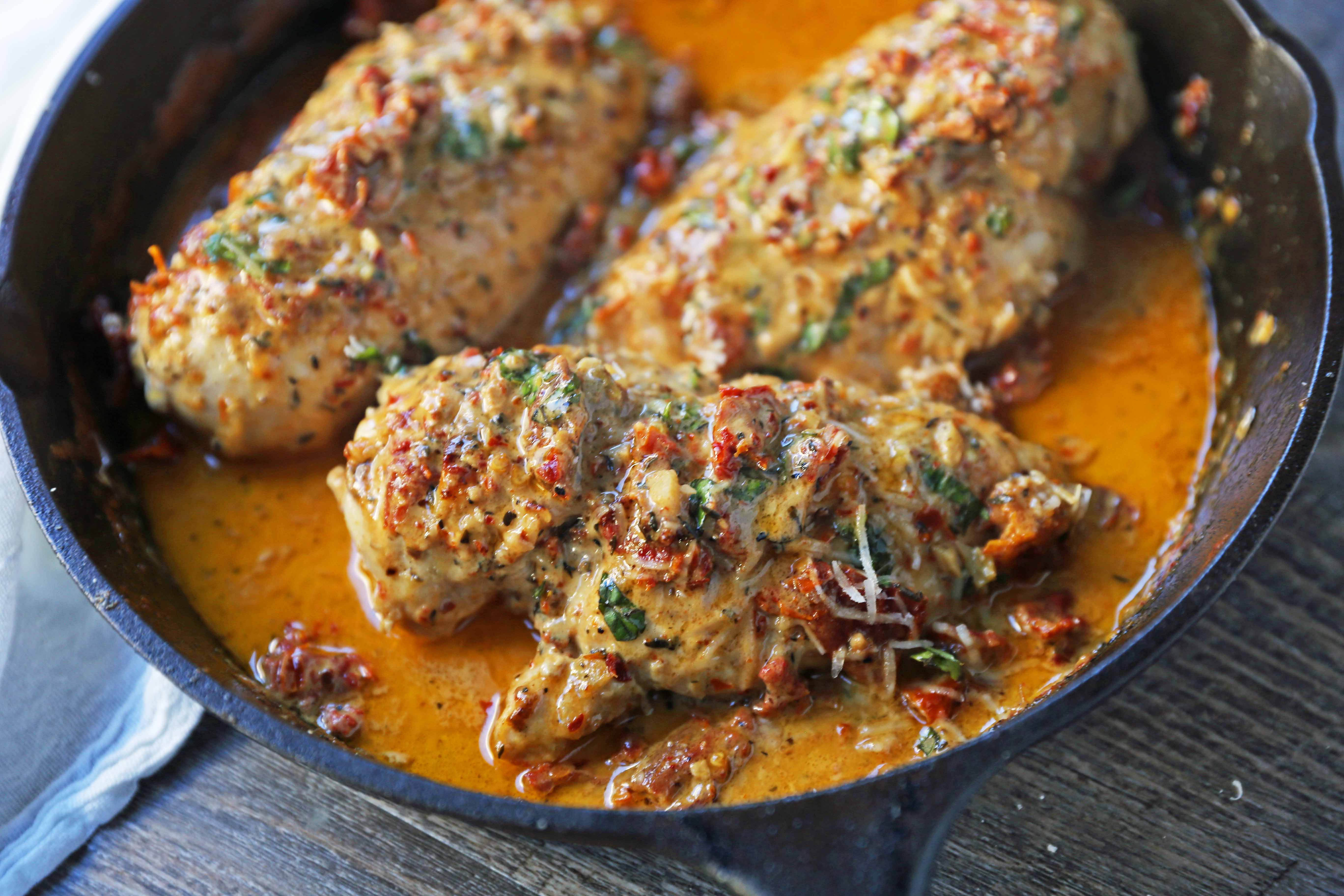 Marry Me Chicken. Famous skillet chicken in a sundried tomato parmesan cream sauce with fresh basil. It will definitely inspire marriage proposals! www.modernhoney.com #chicken #skilletchicken #marrymechicken #30minutemeal #30minutemeals