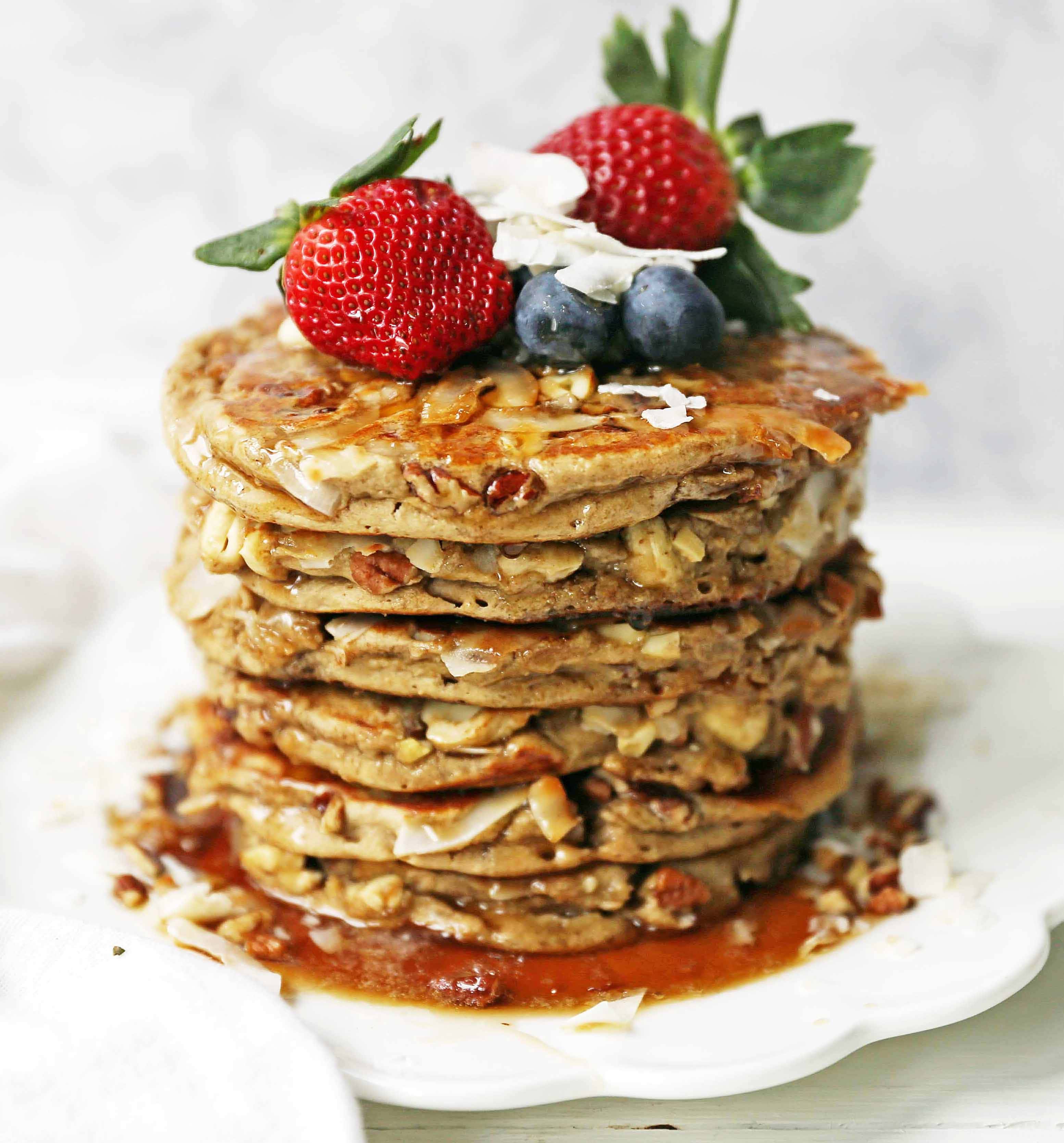 Nutty Granola Pancakes. Gluten-Free, Dairy-Free, No Added Sugar, Healthy Pancakes filled with oats, nuts, and coconut flakes. A hearty, filling breakfast! www.modernhoney.com #pancakes #pancake #healthy #glutenfree #dairyfree #breakfast