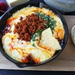 Queso Fundido with Chorizo. A skillet of melted Mexican cheeses seasoned with peppers, onions, and spicy Mexican chorizo sausage and served with hot tortillas or chips. The perfect Mexican appetizer! www.modernhoney.com #appetizer #appetizers #mexican #mexicanfood #queso #quesofundido