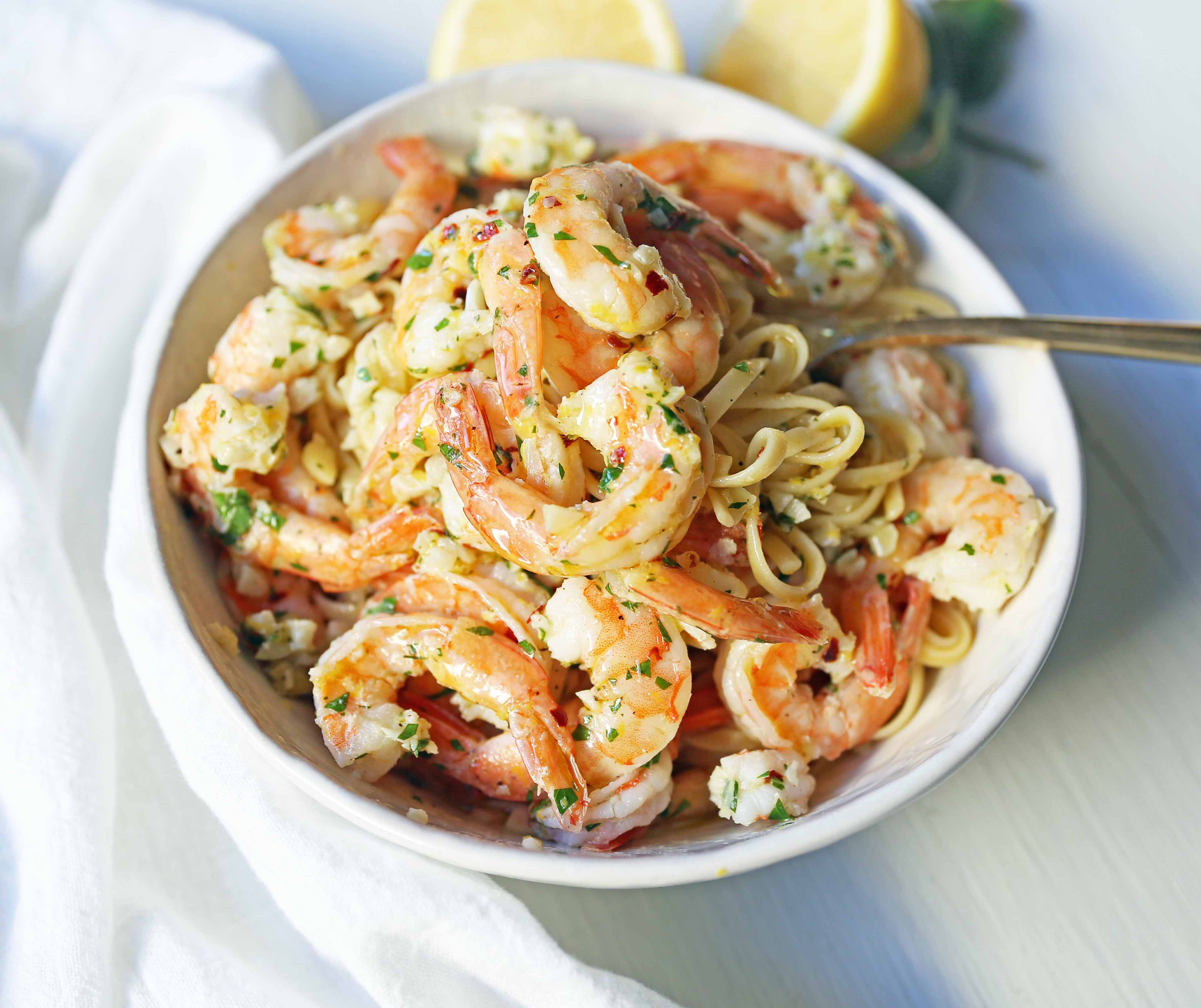 Shrimp Scampi Linguine. Shrimp sauteed in a lemon garlic butter sauce tossed with linguine pasta and made in less than 20 minutes. www.modernhoney.com #shrimp #shrimpscampi #shrimpscampilinguine #pasta #valentinesday