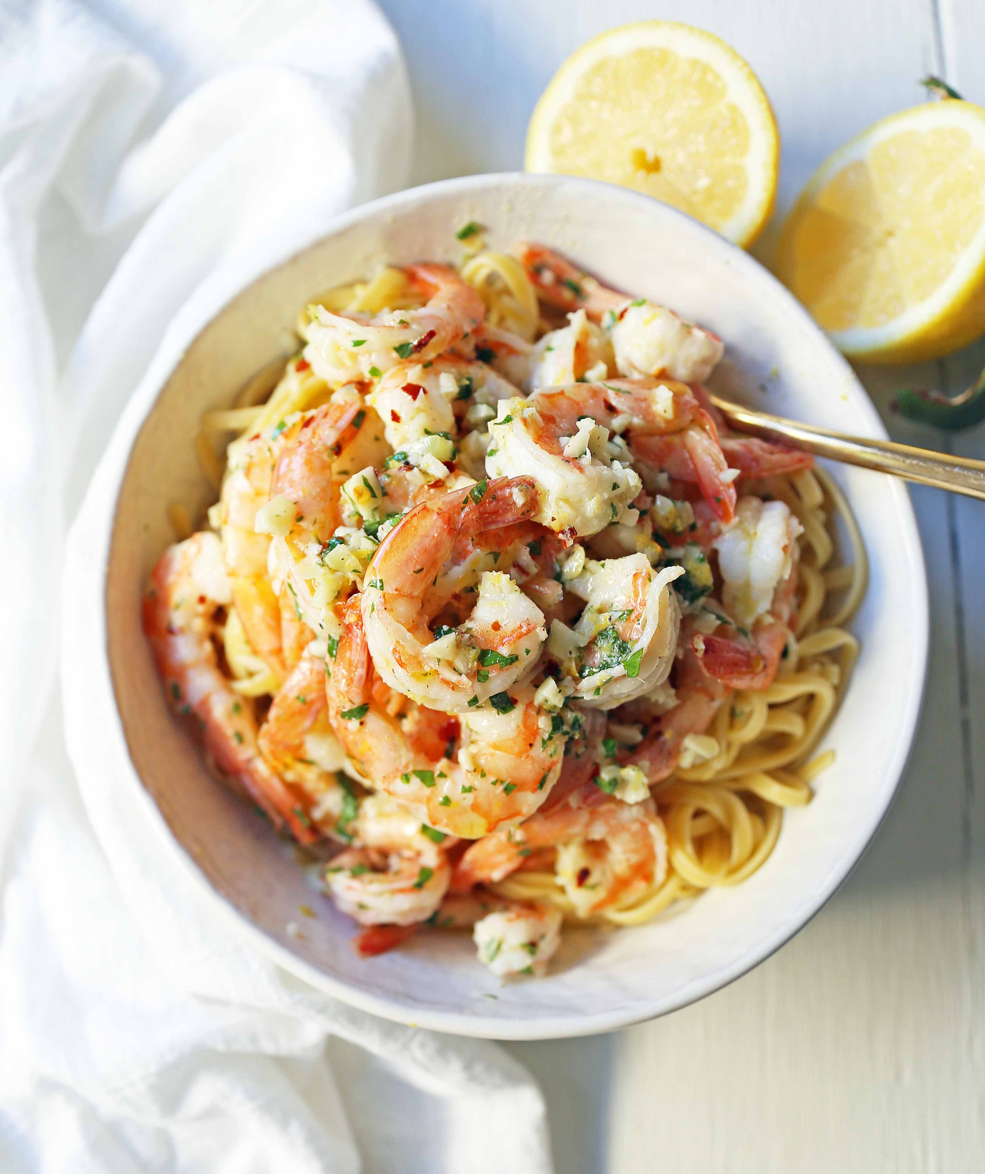 Shrimp Scampi Linguine. Shrimp sauteed in a lemon garlic butter sauce tossed with linguine pasta and made in less than 20 minutes. www.modernhoney.com #shrimp #shrimpscampi #shrimpscampilinguine #pasta #valentinesday