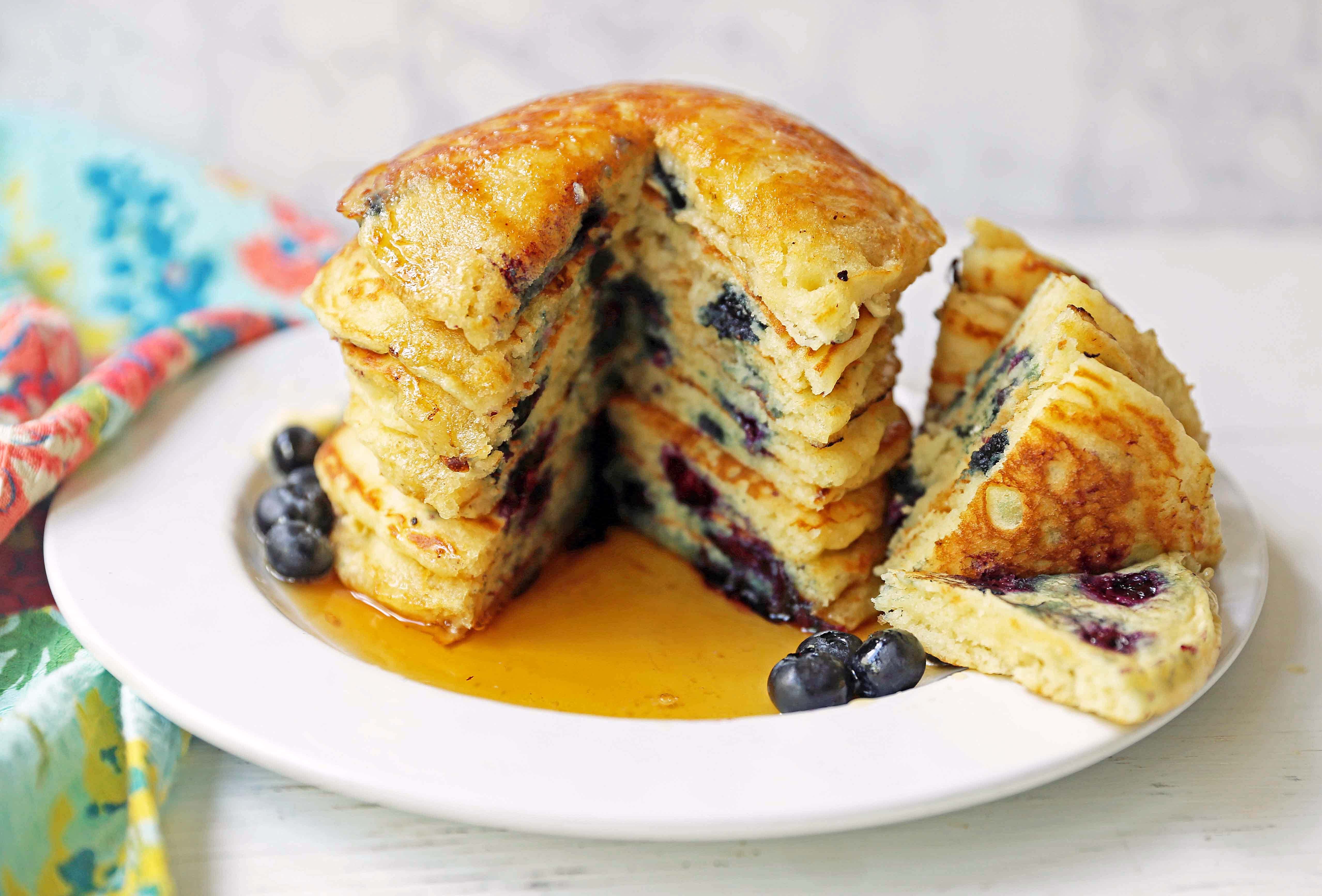 Homemade fluffy blueberry pancakes are made with fresh blueberries and are the best buttermilk blueberry pancakes ever! These are easy blueberry pancakes made from scratch. 