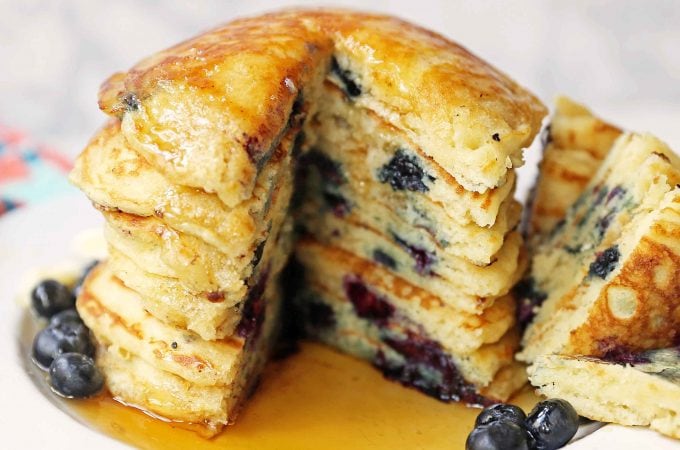 Homemade Blueberry Buttermilk Pancakes are light and fluffy. How to make the perfect blueberry pancakes. Tips and tricks for making the best blueberry pancakes. www.modernhoney.com #blueberrypancakes #blueberrybuttermilkpancakes #pancakes #pancakerecipes