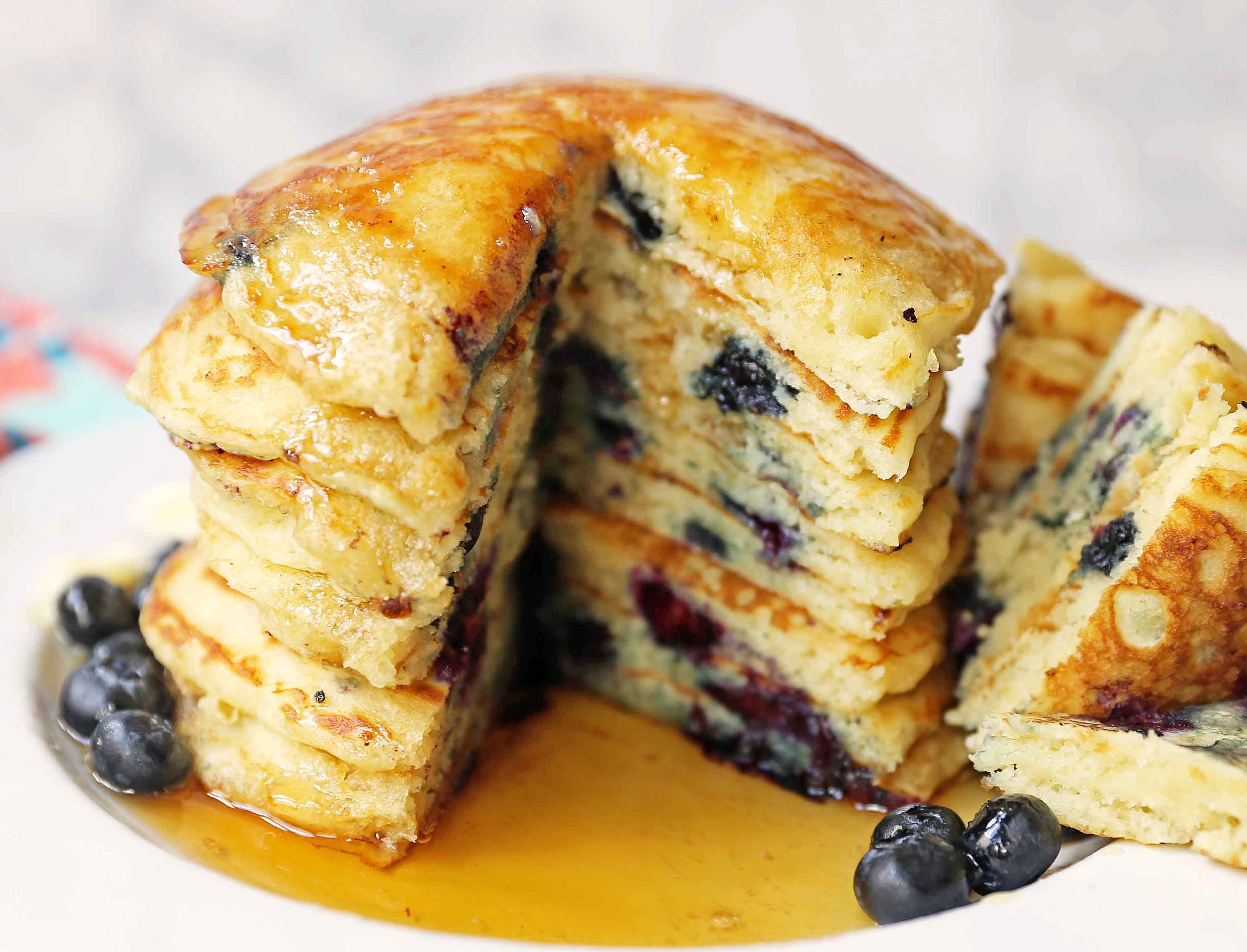 Homemade fluffy blueberry pancakes are made with fresh blueberries and are the best buttermilk blueberry pancakes ever! These are easy blueberry pancakes made from scratch. 