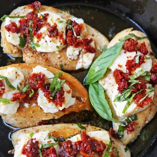 Chicken Bryan. Grilled chicken with a basil lemon butter sauce topped with sundried tomatoes and creamy goat cheese. A Carrabba's favorite! www.modernhoney.com #chickenbryan #carrabbas #chicken