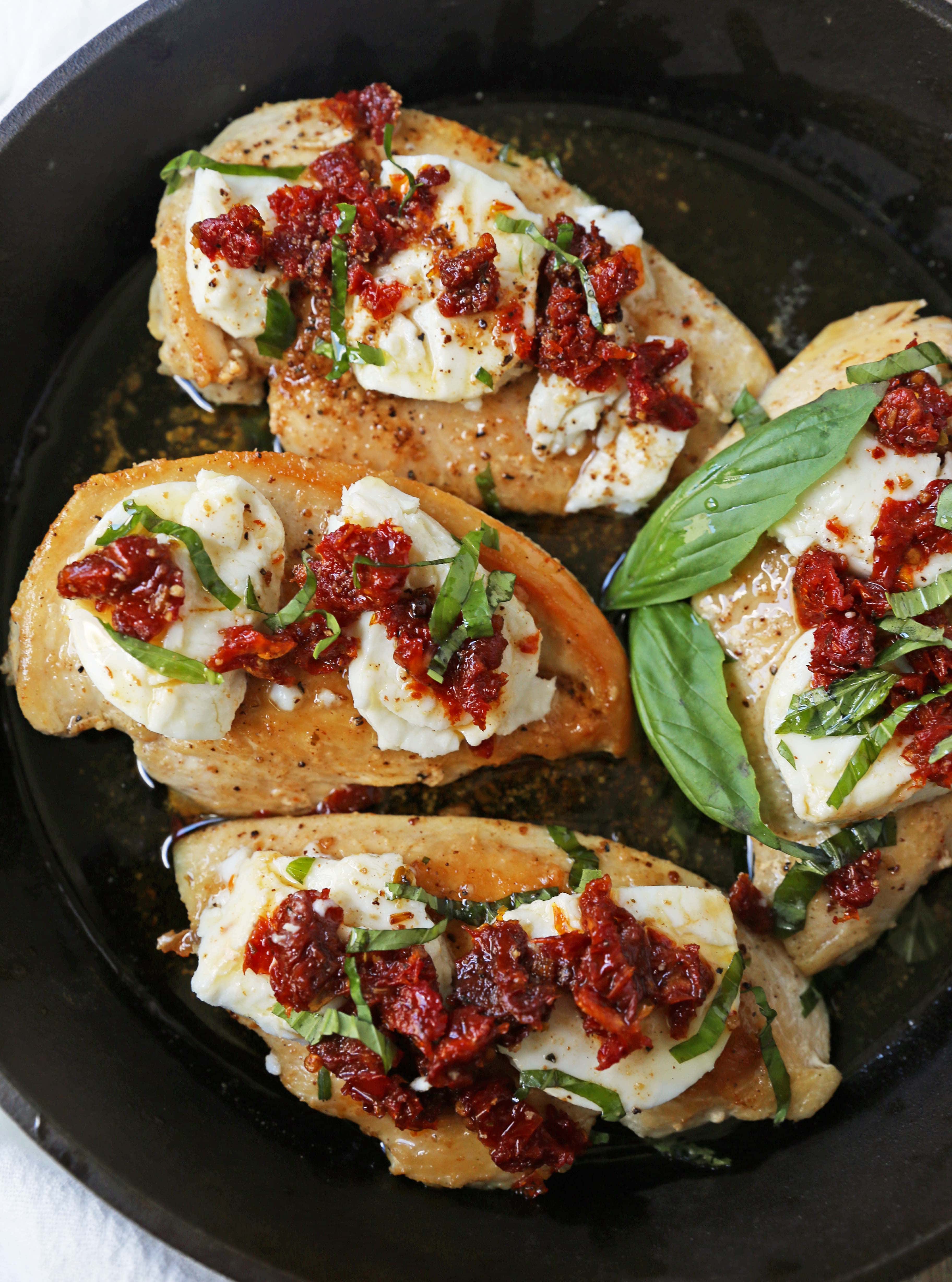 Chicken Bryan. Grilled chicken with a basil lemon butter sauce topped with sundried tomatoes and creamy goat cheese. A Carrabba's favorite! www.modernhoney.com #chickenbryan #carrabbas #chicken