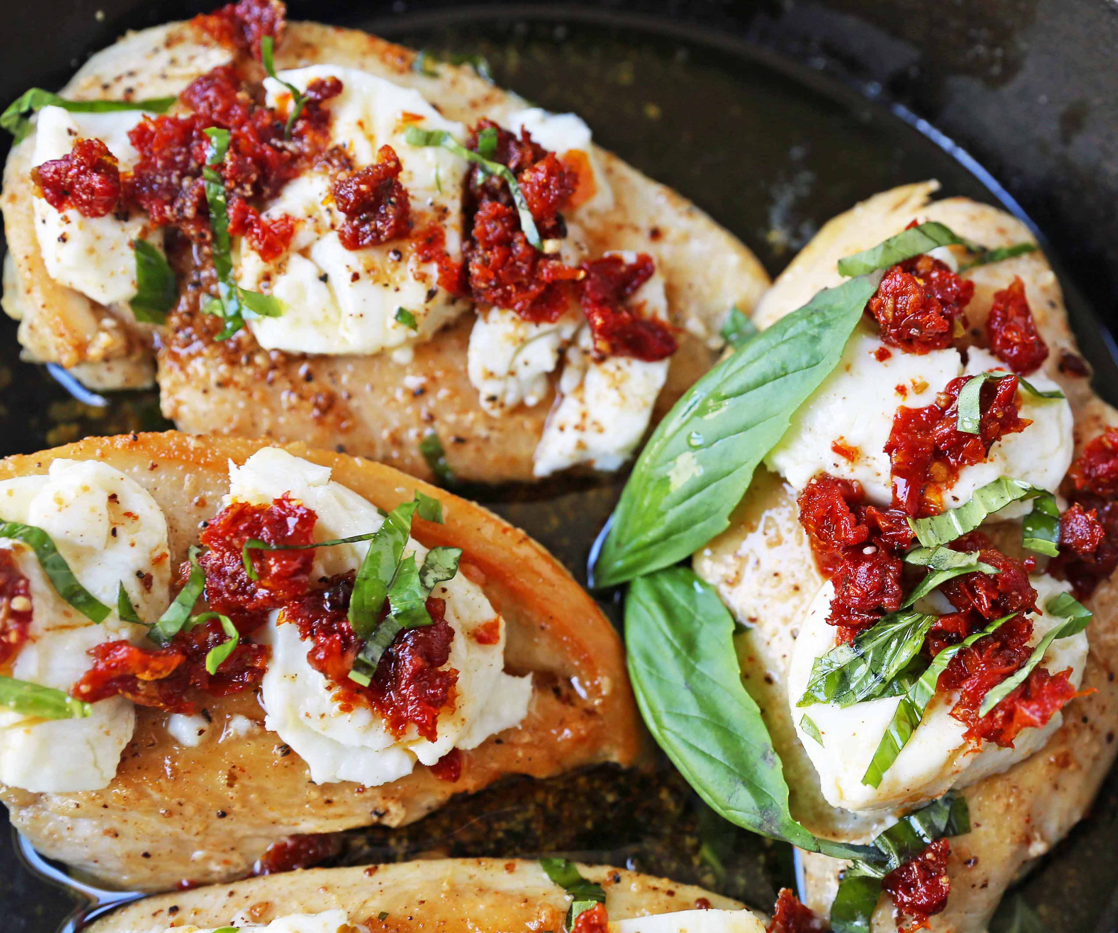 Chicken Bryan. Grilled chicken with a basil lemon butter sauce topped with sundried tomatoes and creamy goat cheese. A Carrabba's favorite! www.modernhoney.com #chickenbryan #carrabbas #chicken