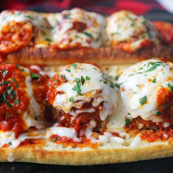 Italian Meatball Subs. Homemade beef parmesan meatballs in a fresh marinara sauce topped with melted mozzarella cheese all on toasted bread. The best meatball sub recipe! www.modernhoney.com #meatballs #meatball #meatballsub