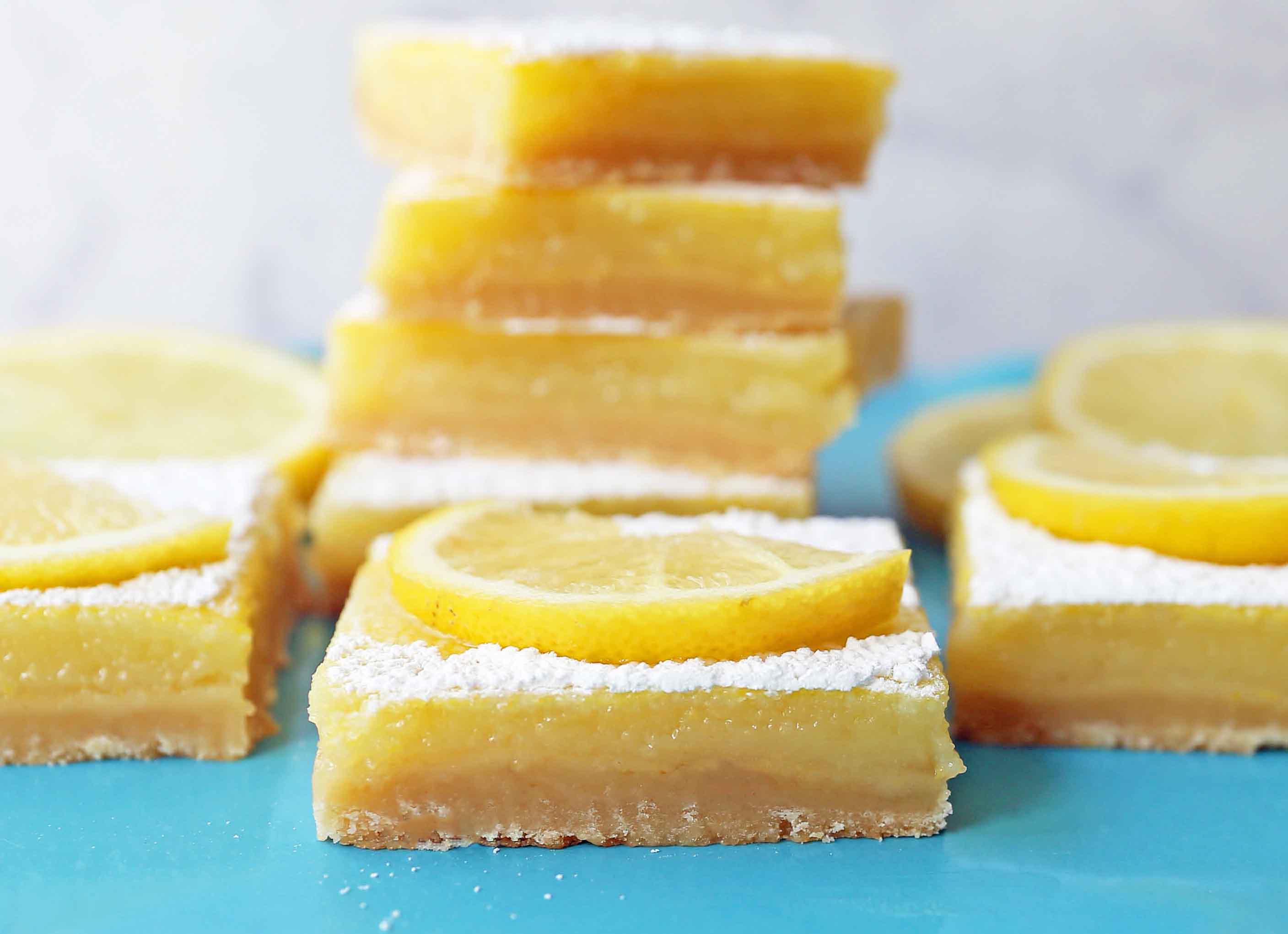 The Best Lemon Bars. Sweet and tangy lemon filling on a buttery shortbread crust. Tips and tricks for making the perfect lemon bar! www.modernhoney.com #lemonbar #lemonbars #lemondesserts #lemondessert #lemonsquare #lemonsquares