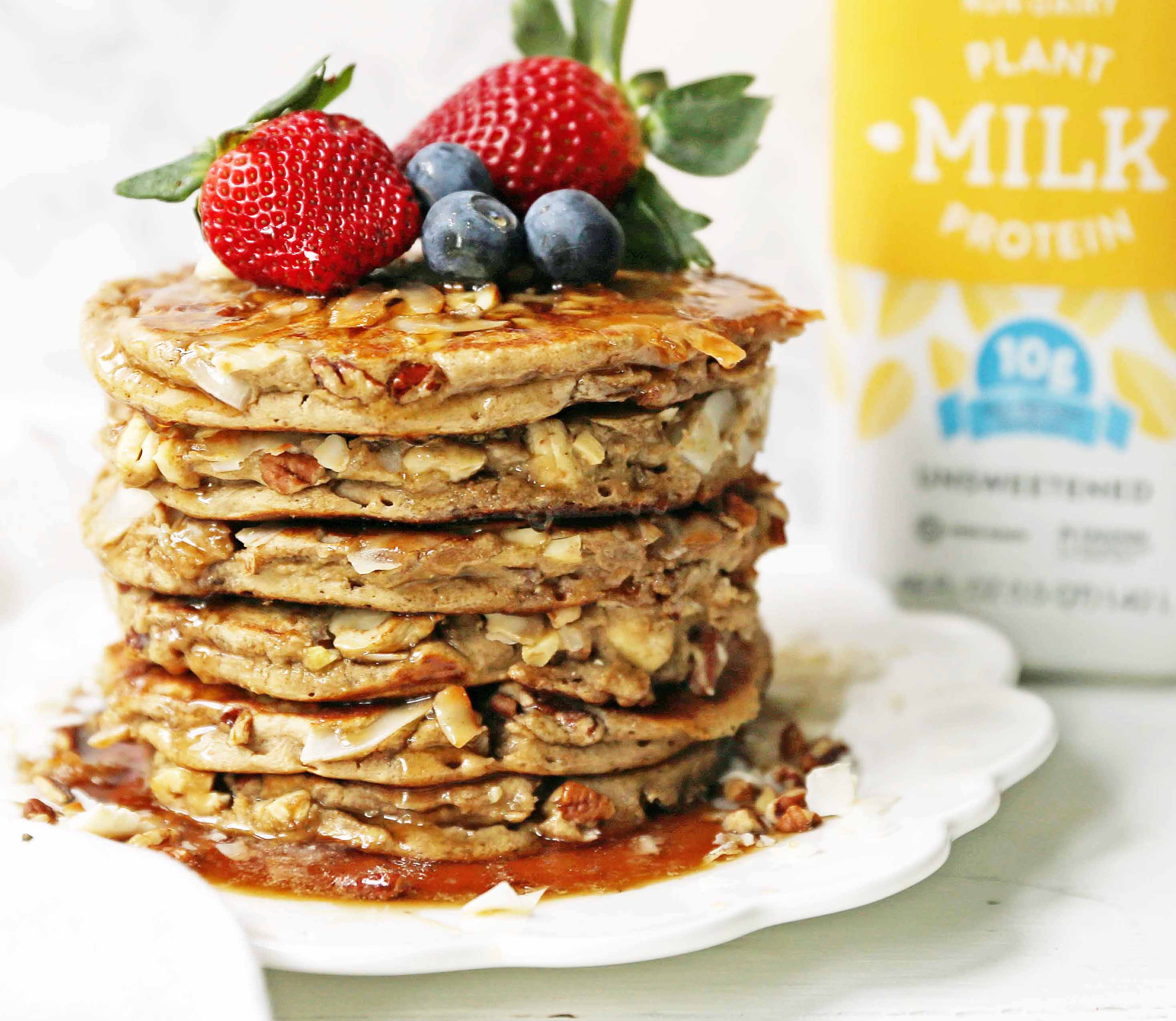 Nutty Granola Pancakes. Gluten-Free, Dairy-Free, No Added Sugar, Healthy Pancakes filled with oats, nuts, and coconut flakes. A hearty, filling breakfast! www.modernhoney.com #pancakes #pancake #healthy #glutenfree #dairyfree #breakfast