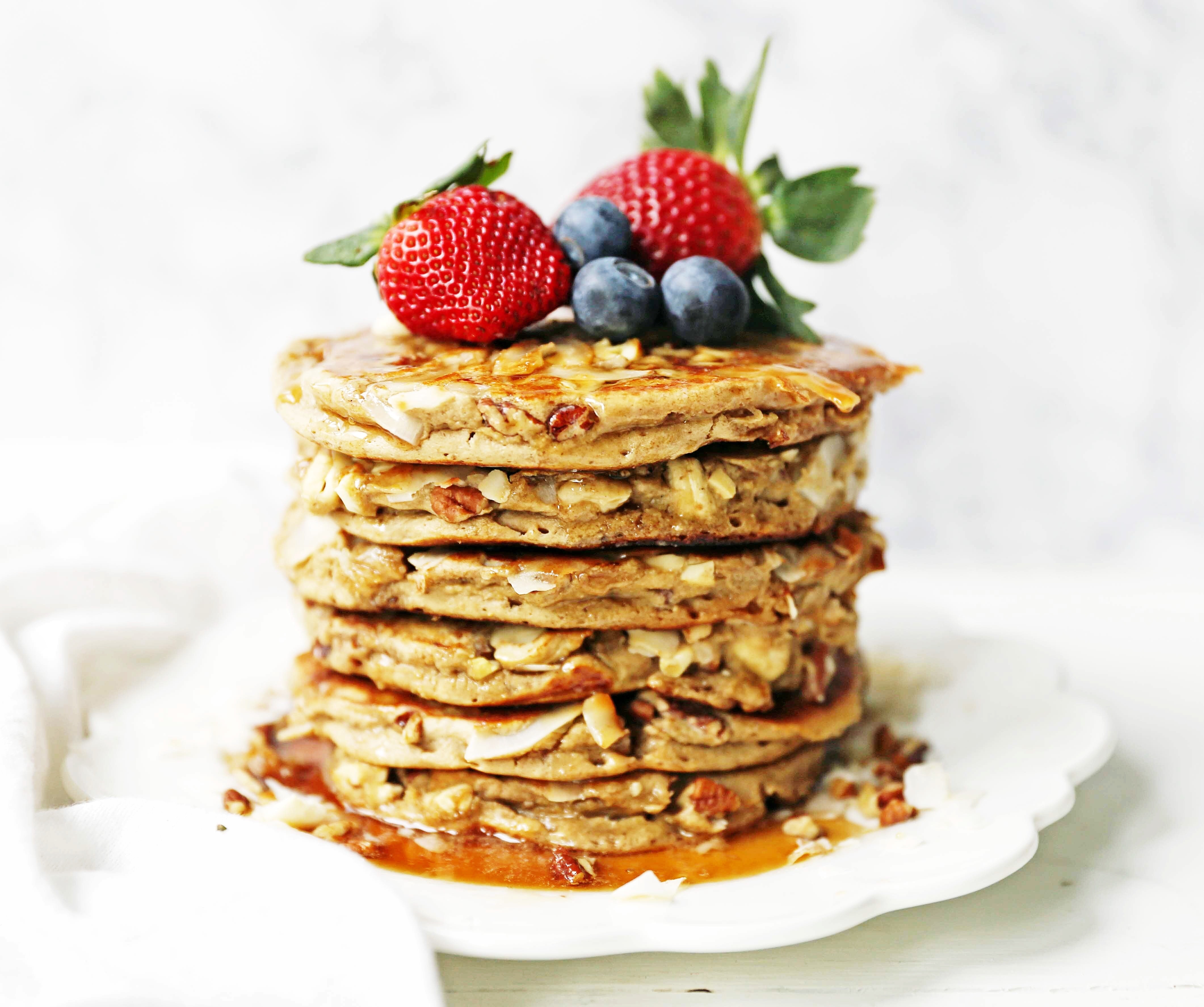 Nutty Granola Pancakes. Gluten-Free, Dairy-Free, No Added Sugar, Healthy Pancakes filled with oats, nuts, and coconut flakes. A hearty, filling breakfast! www.modernhoney.com #pancakes #pancake #healthy #glutenfree #dairyfree #breakfast
