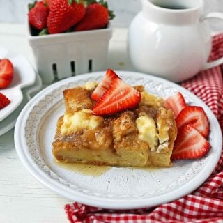 Baked French Toast Casserole. Challah bread soaked in a rich sweet custard with sweet cream cheese and topped with a brown sugar streusel topping. An easy overnight french toast recipe. www.modernhoney.com #frenchtoast #bakedfrenchtoast #breakfast #overnightfrenchtoast