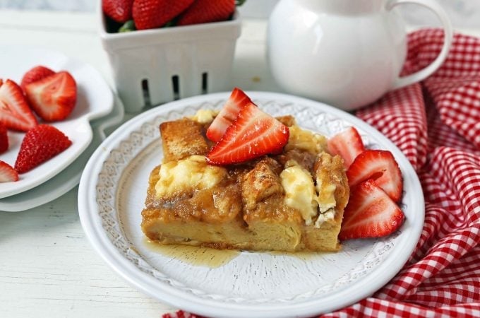 Baked French Toast Casserole. Challah bread soaked in a rich sweet custard with sweet cream cheese and topped with a brown sugar streusel topping. An easy overnight french toast recipe. www.modernhoney.com #frenchtoast #bakedfrenchtoast #breakfast #overnightfrenchtoast