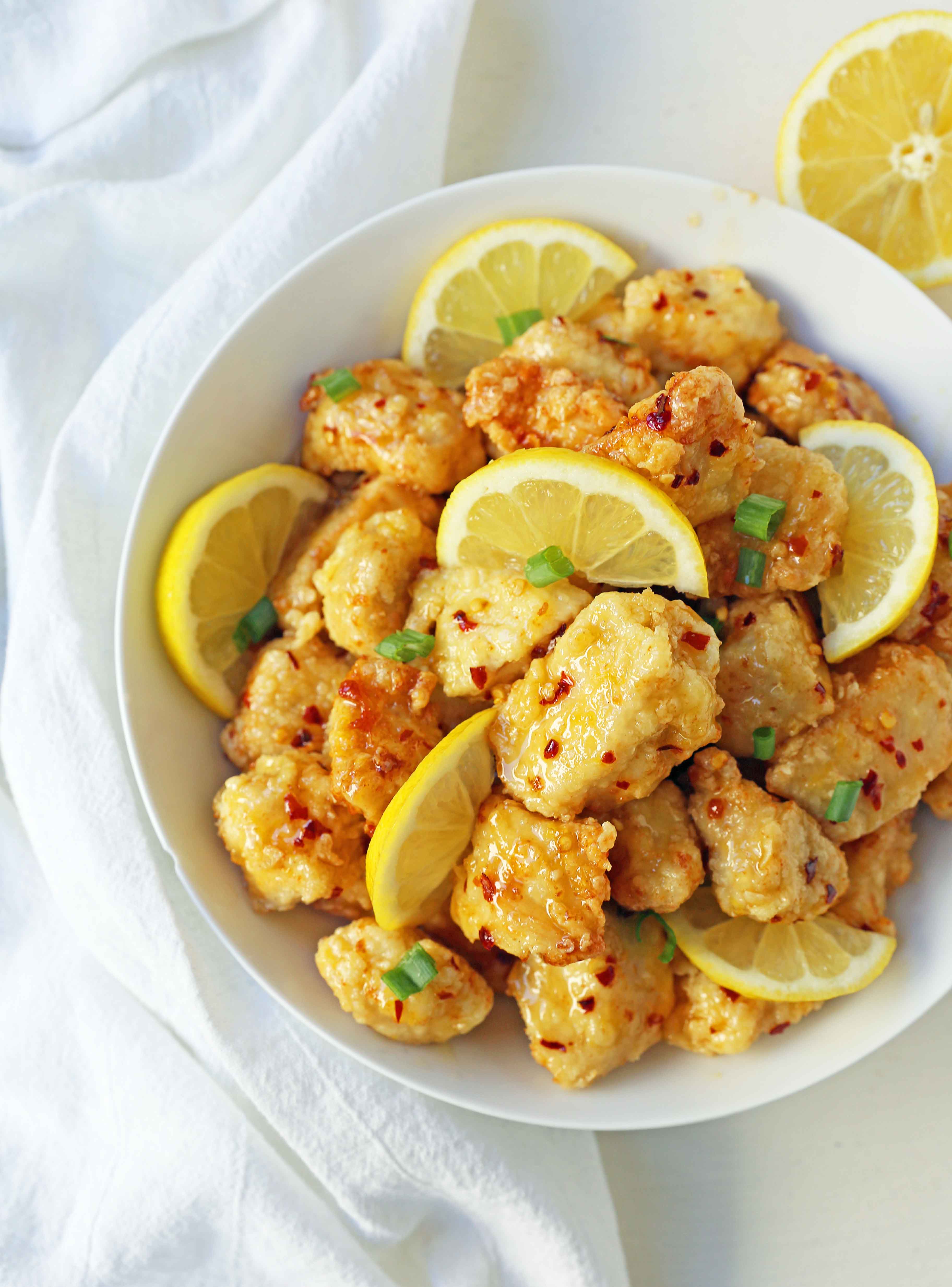 Chinese Lemon Chicken made with crispy fried chicken covered in an authentic, fresh lemon sauce. The ultimate Chinese Lemon Chicken Recipe which is way better than take-out. www.modernhoney.com #chinesefood #asianfood #lemonchicken #chineselemonchicken