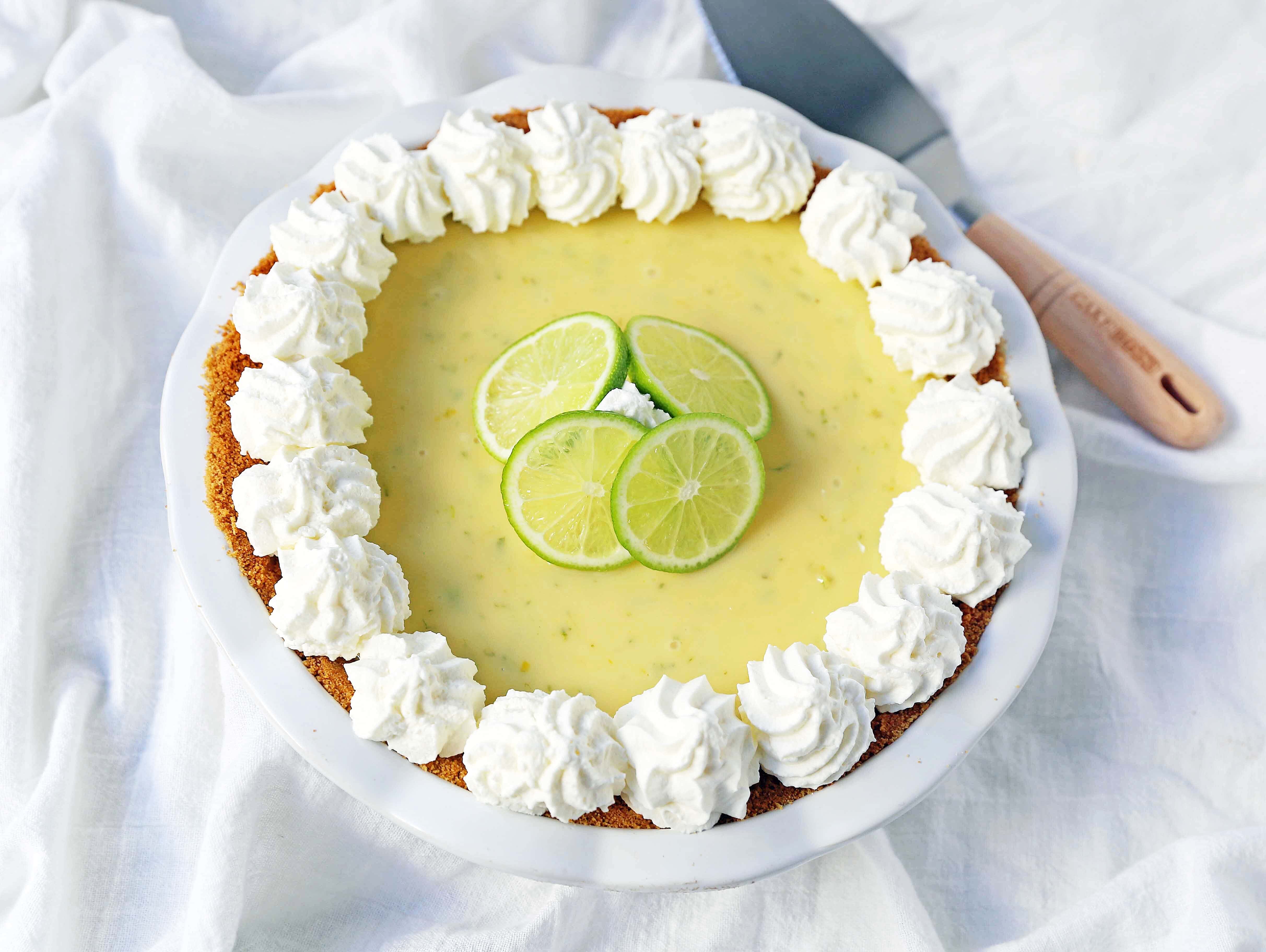 Key Lime Pie. The best creamy key lime pie in a buttery graham cracker crust with fresh sweetened whipped cream. www.modernhoney.com #keylimepie #limepie #pie #easterdesserts