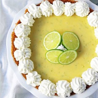 Key Lime Pie. The best creamy key lime pie in a buttery graham cracker crust with fresh sweetened whipped cream. www.modernhoney.com #keylimepie #limepie #pie #easterdesserts