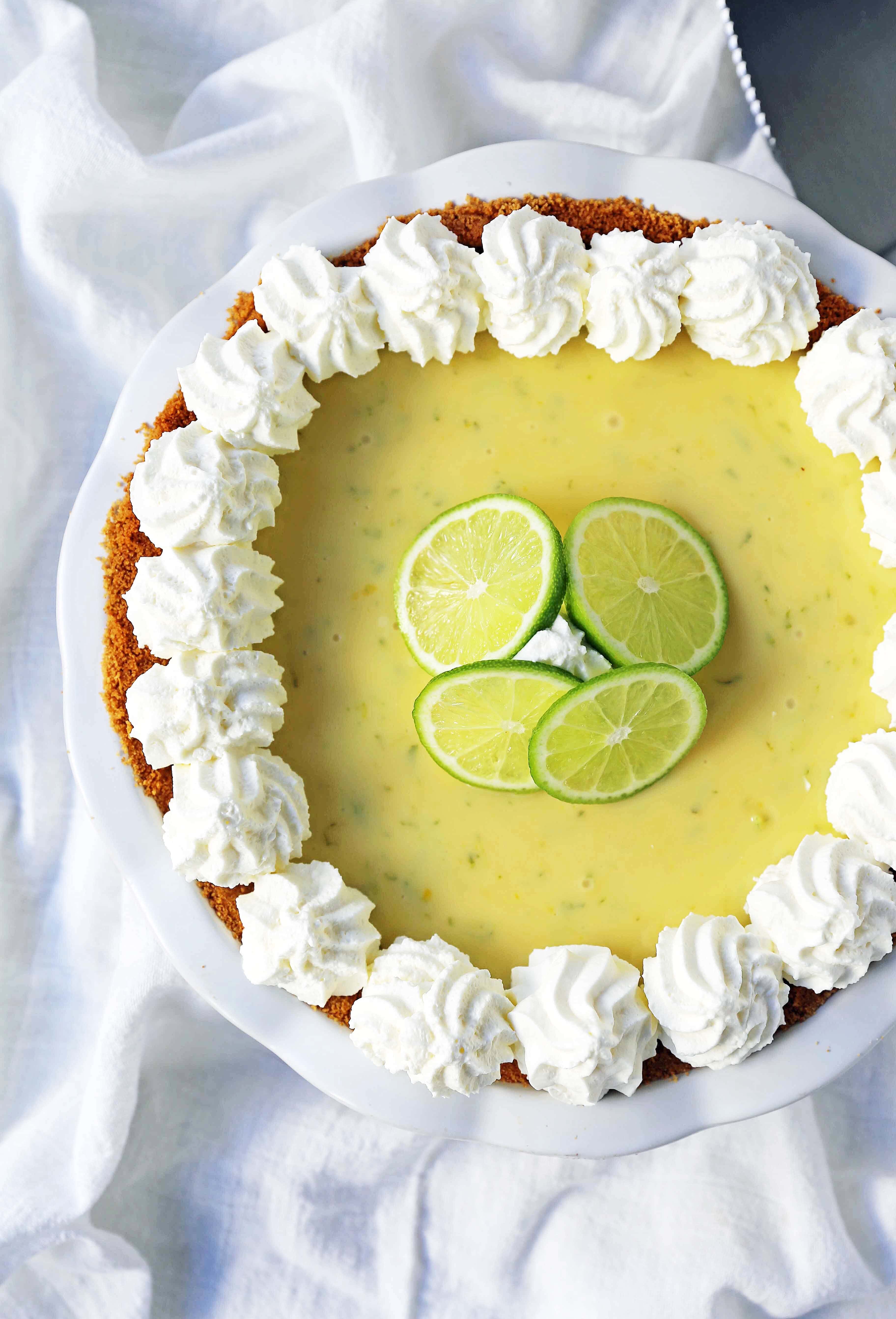 Key Lime Pie. The best creamy key lime pie in a buttery graham cracker crust with fresh sweetened whipped cream. www.modernhoney.com #keylimepie #limepie #pie #easterdesserts