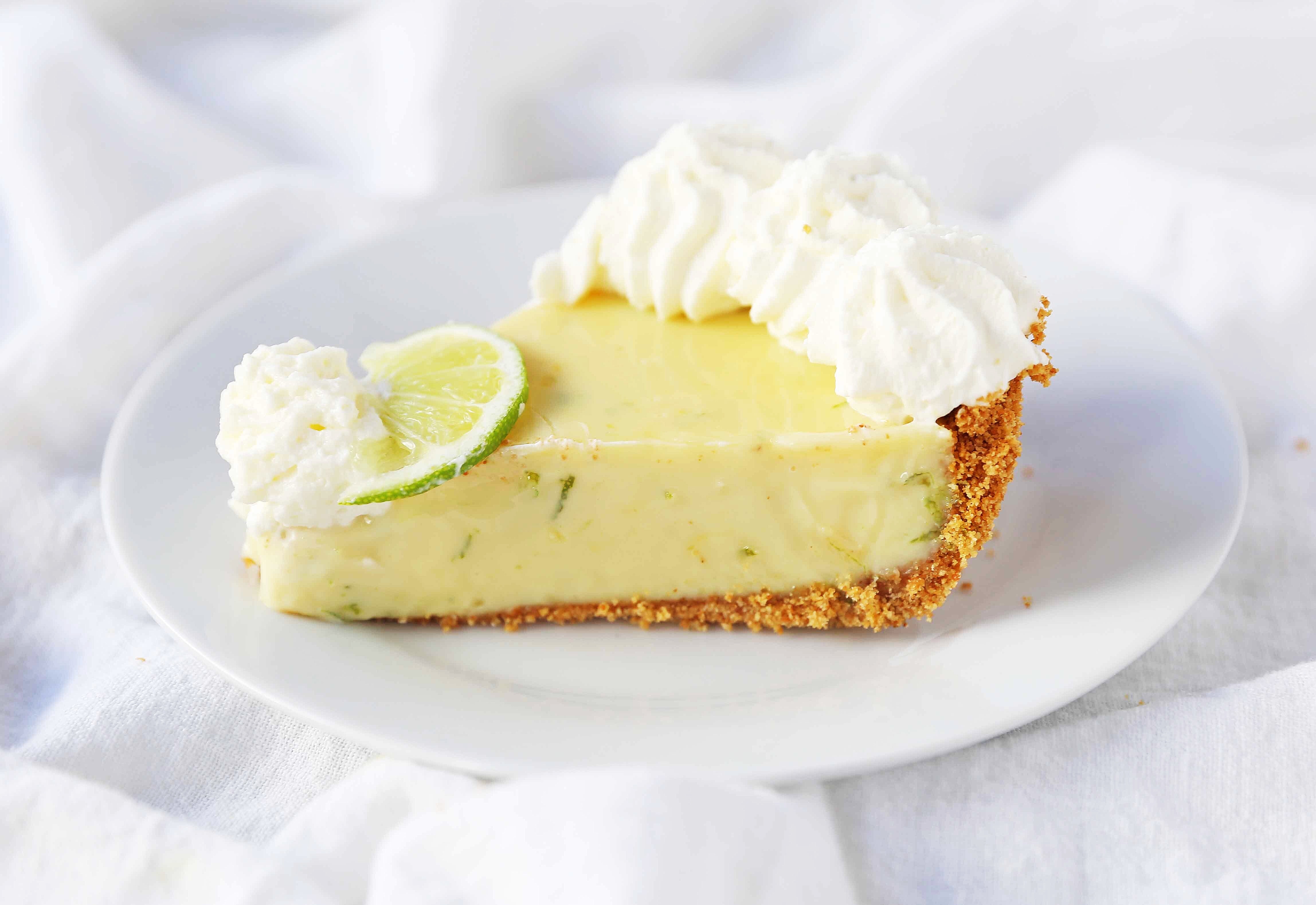 Key Lime Pie. The best creamy key lime pie in a buttery graham cracker crust with fresh sweetened whipped cream. www.modernhoney.com #keylimepie #limepie #pie #easterdesserts