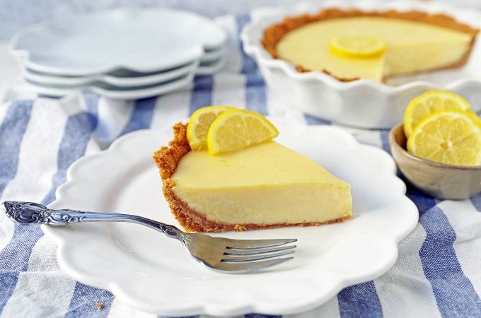 Lemon Cream Pie. A simple creamy lemon cream pie with fresh lemon zest in a buttery graham cracker crust with sweetened whipped cream. The BEST Lemon Pie Recipe. www.modernhoney.com #lemonpie #lemoncreampie #lemonpierecipe