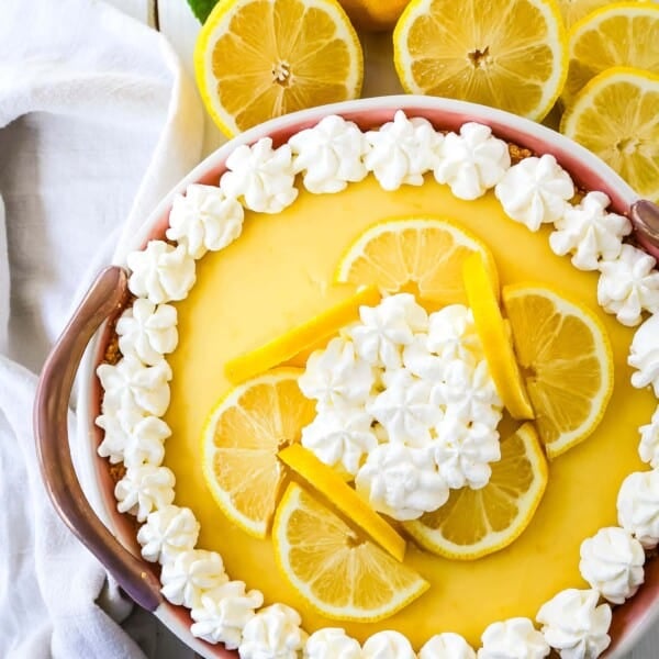 Lemon Cream Pie A simple creamy lemon cream pie with fresh lemon zest in a buttery graham cracker crust with sweetened whipped cream. The best lemon cream pie recipe! www.modernhoney.com #lemonpie #lemoncreampie #lemon #dessert #pie