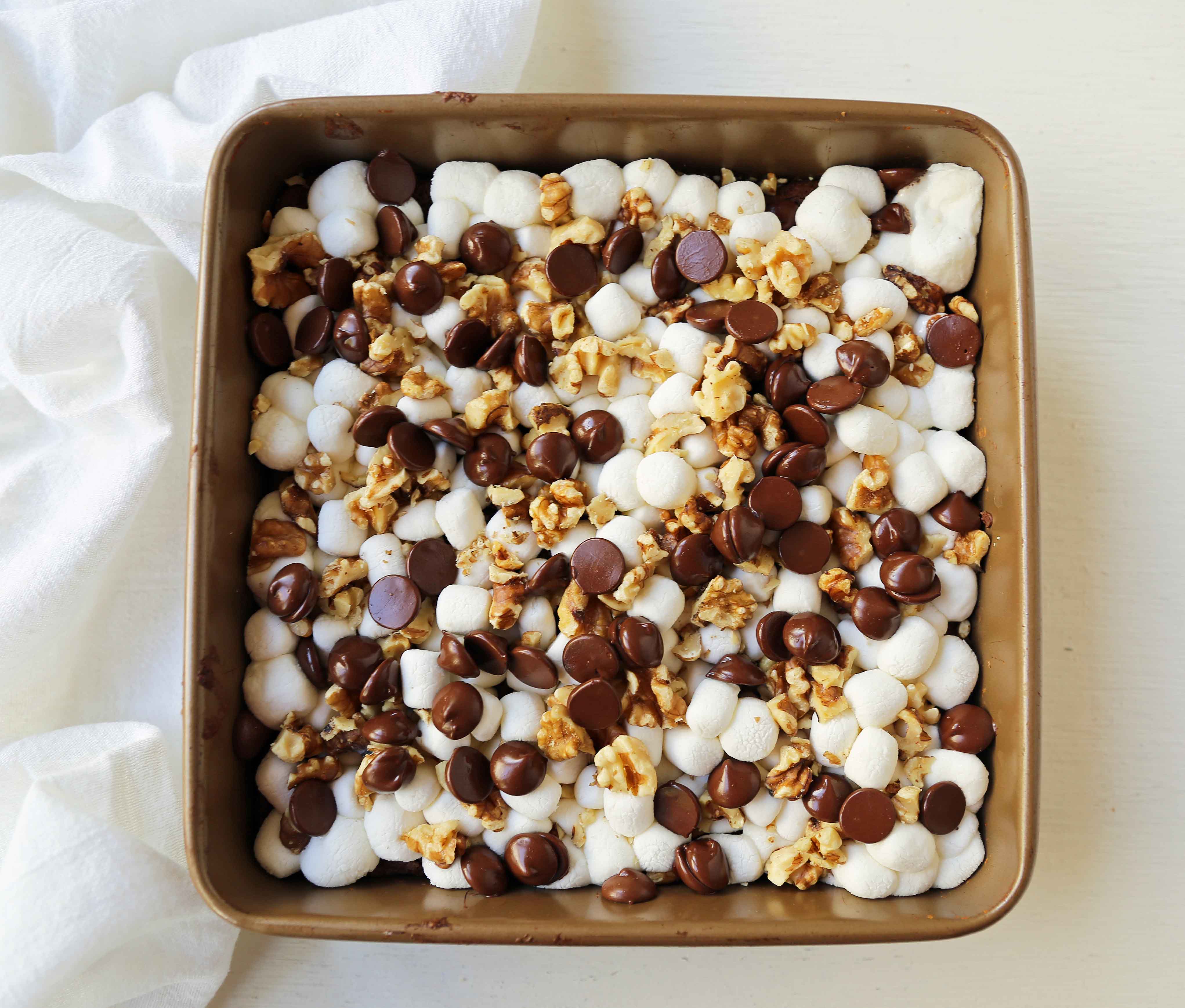 Rocky Road Brownies. Homemade decadent chocolate brownies topped with melted marshmallows, chocolate chips, and walnuts. A classic brownie! www.modernhoney.com #rockyroad #rockyroadbrownies #gourmetbrownies