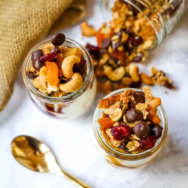 Chocolate Coconut Granola. A decadent chocolate coconut granola with cashews, dried cranberries, apricots, almonds, coconut flakes, and chocolate chips.  The best Chocolate Coconut Granola Recipe. www.modernhoney.com #granola #chocolatecoconutgranola #granolarecipe