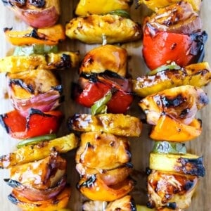 Hawaiian Teriyaki Chicken Skewers Grilled chicken skewers with peppers, onions, pineapple, and jalapeño basted in a sweet and salty teriyaki sauce and grilled to perfection. www.modernhoney.com #chickenskewers #chickenkabobs #teriyakichicken