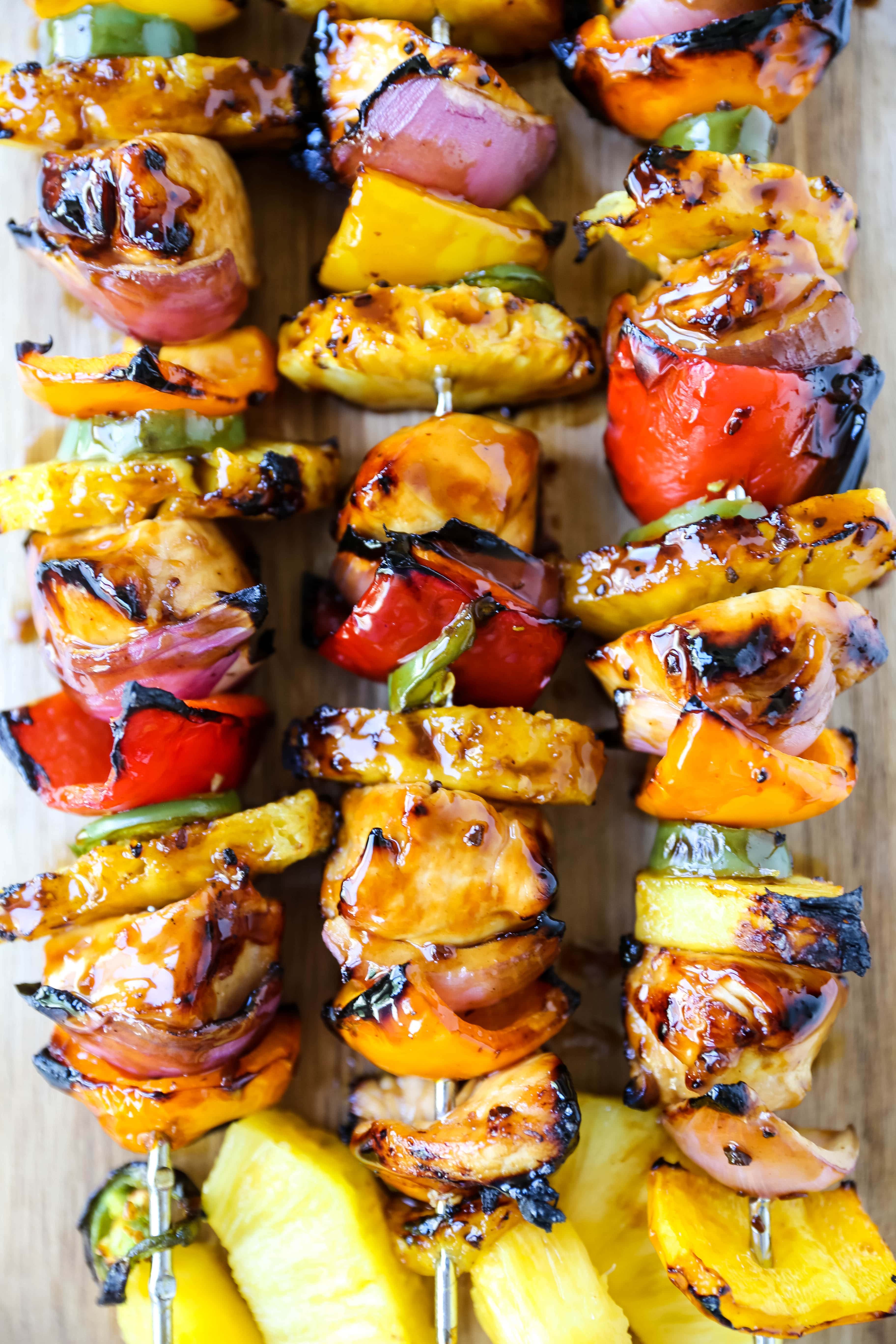 Hawaiian Teriyaki Chicken Skewers Grilled chicken skewers with peppers, onions, pineapple, and jalapeño basted in a sweet and salty teriyaki sauce and grilled to perfection. www.modernhoney.com #chickenskewers #chickenkabobs #teriyakichicken 