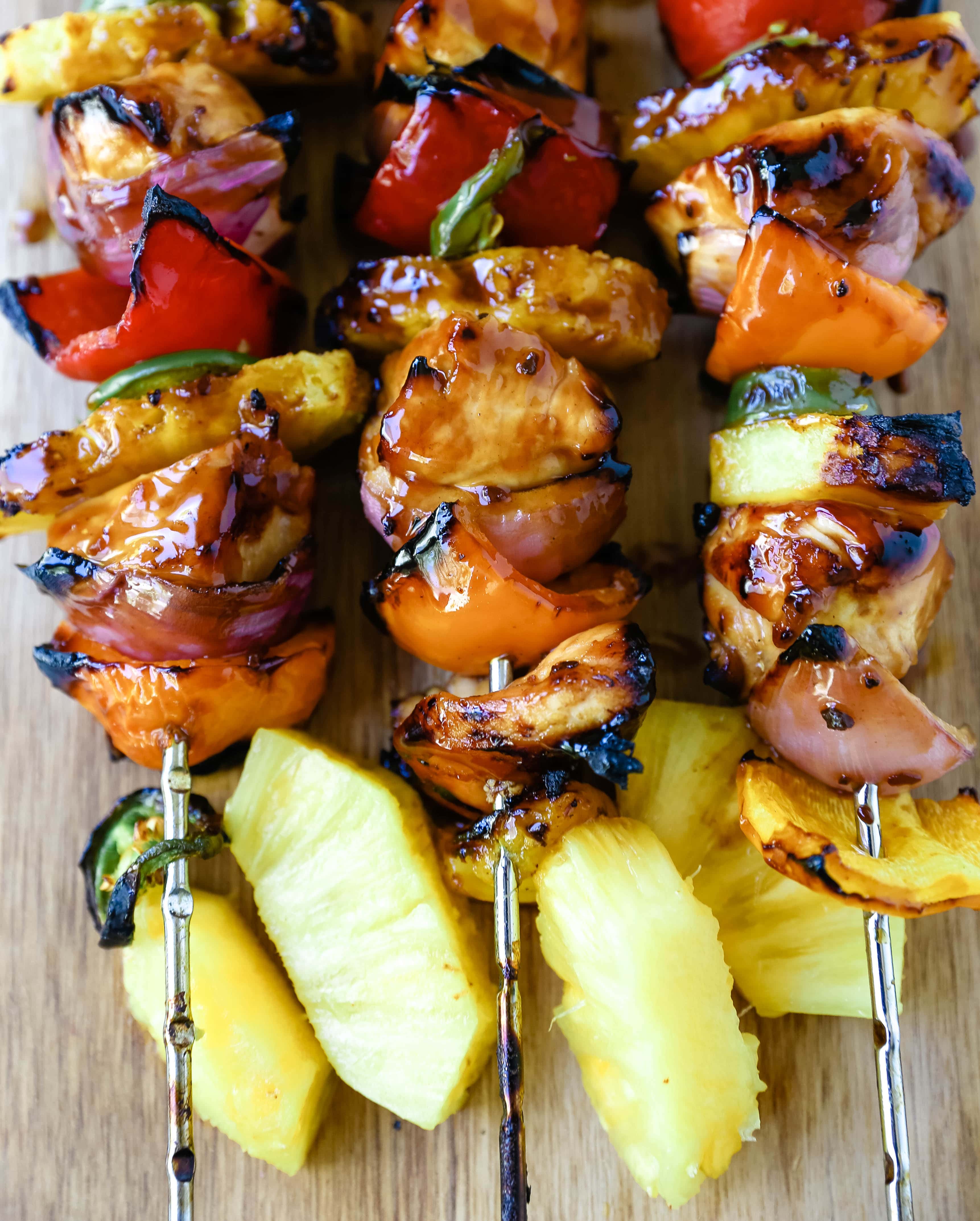 Hawaiian Teriyaki Chicken Skewers Grilled chicken skewers with peppers, onions, pineapple, and jalapeño basted in a sweet and salty teriyaki sauce and grilled to perfection. www.modernhoney.com #chickenskewers #chickenkabobs #teriyakichicken 