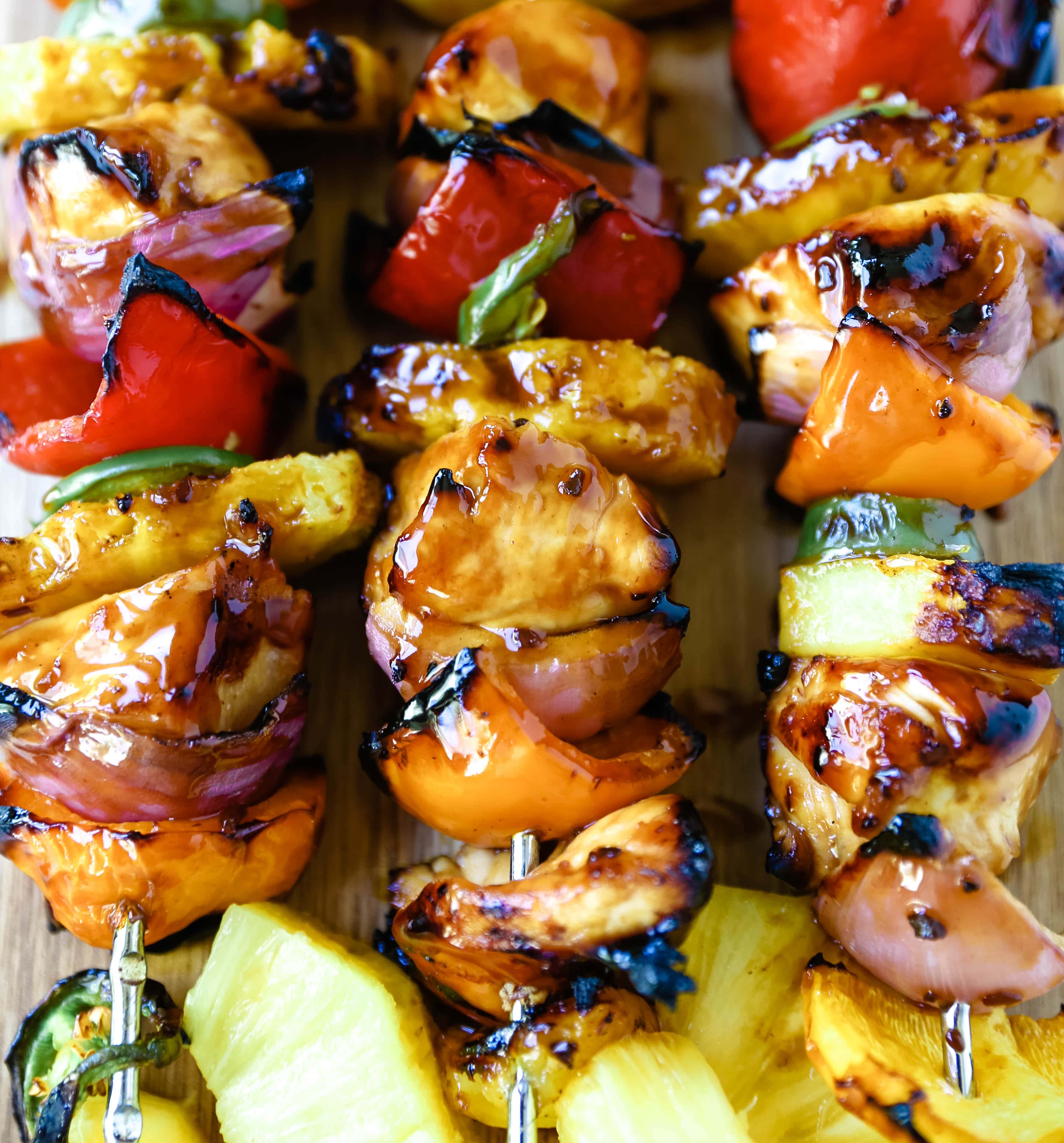 Hawaiian Teriyaki Chicken Skewers Grilled chicken skewers with peppers, onions, pineapple, and jalapeño basted in a sweet and salty teriyaki sauce and grilled to perfection. www.modernhoney.com #chickenskewers #chickenkabobs #teriyakichicken 