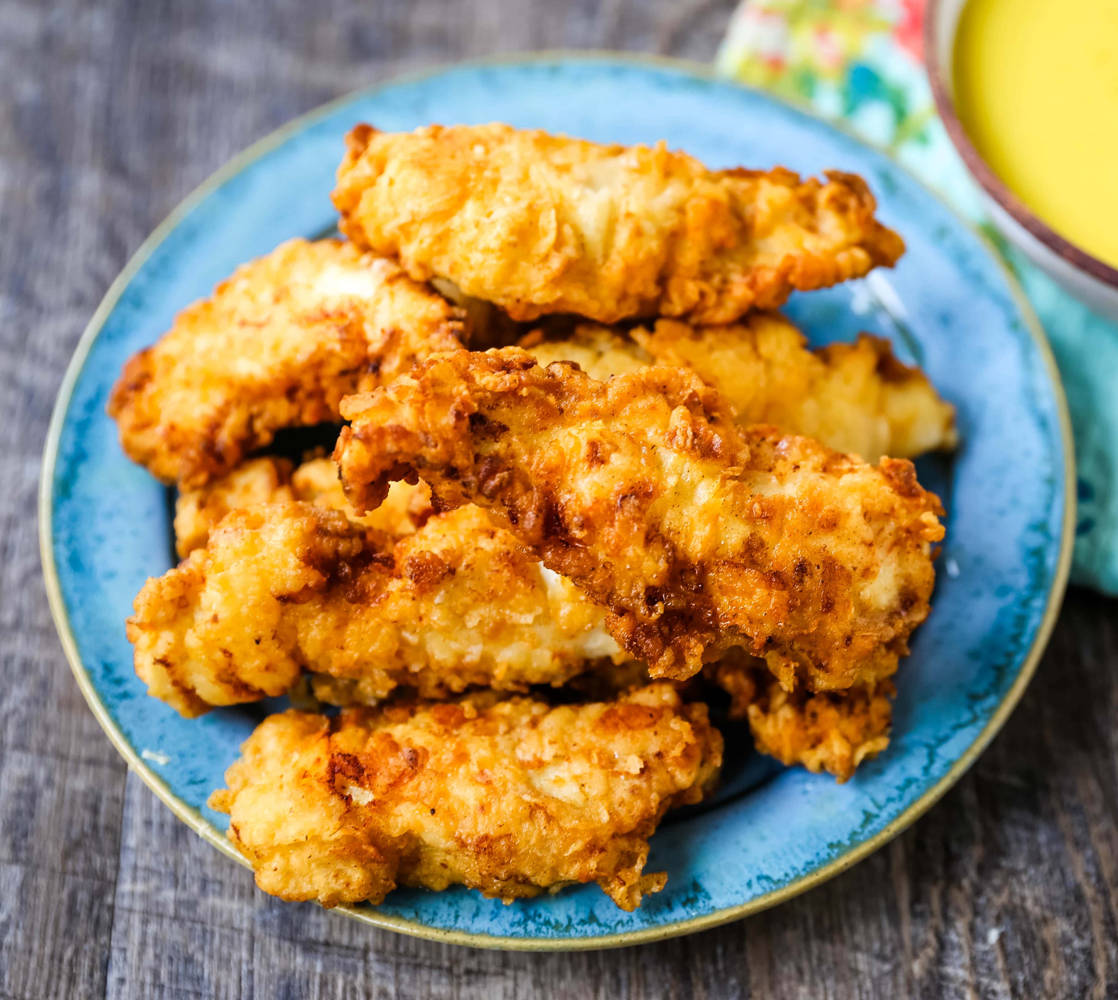 Fried Chicken Tenders Juicy, tender, marinated chicken dipped in coating and fried until perfectly crispy. The best fried chicken tenders recipe! www.modernhoney.com #chicken #chickentenders #friedchicken #friedchickentenders