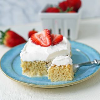 Tres Leches Cake. A classic Mexican dessert made with a vanilla sponge cake soaked with three kinds of milk -- heavy cream, evaporated milk and sweetened condensed milk and topped with whipped cream.  www.modernhoney.com #treslechescake #threemilkcake #cincodemayo