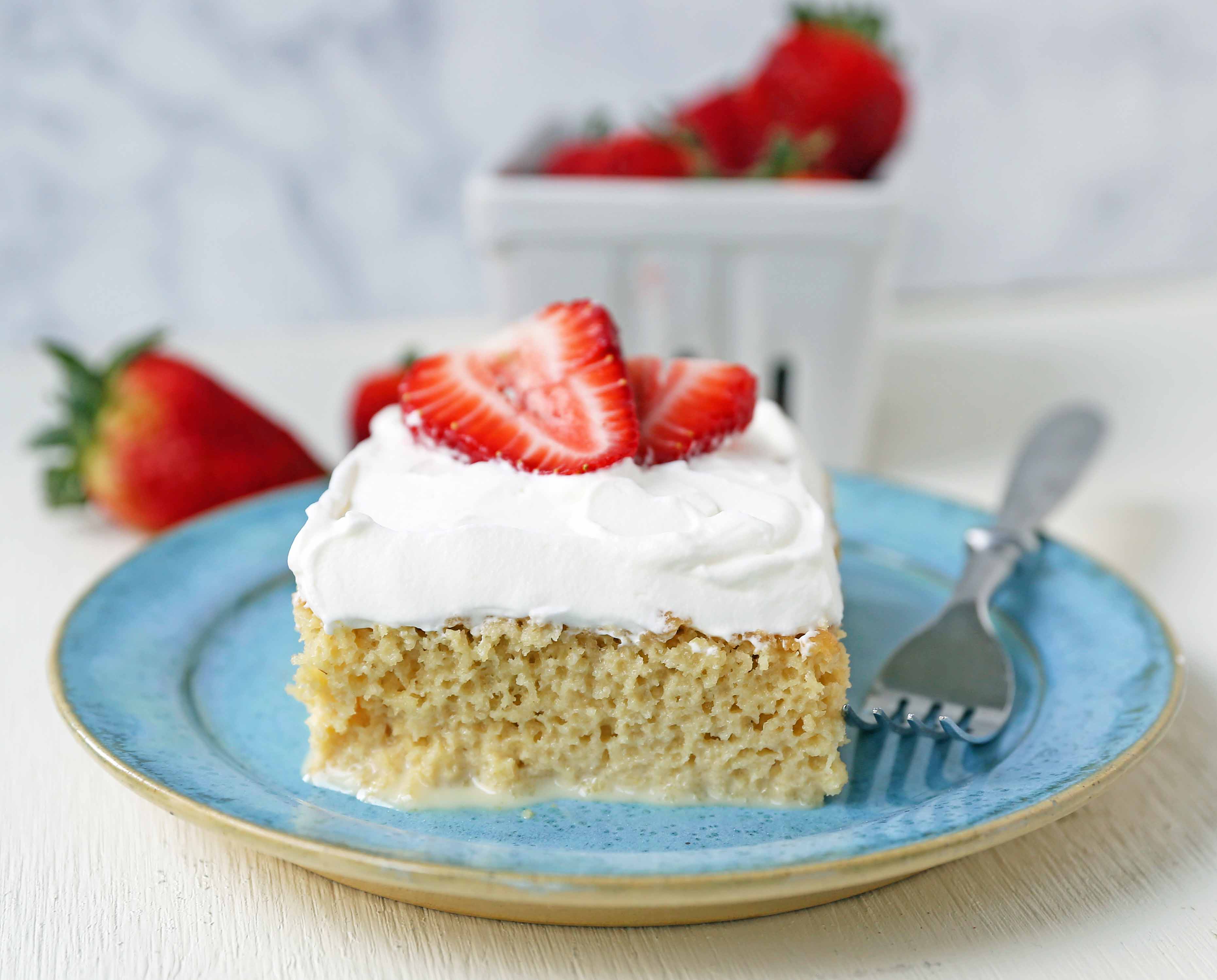 Tres Leches Cake. A classic Mexican dessert made with a vanilla sponge cake soaked with three kinds of milk -- heavy cream, evaporated milk and sweetened condensed milk and topped with whipped cream.  www.modernhoney.com #treslechescake #threemilkcake #cincodemayo