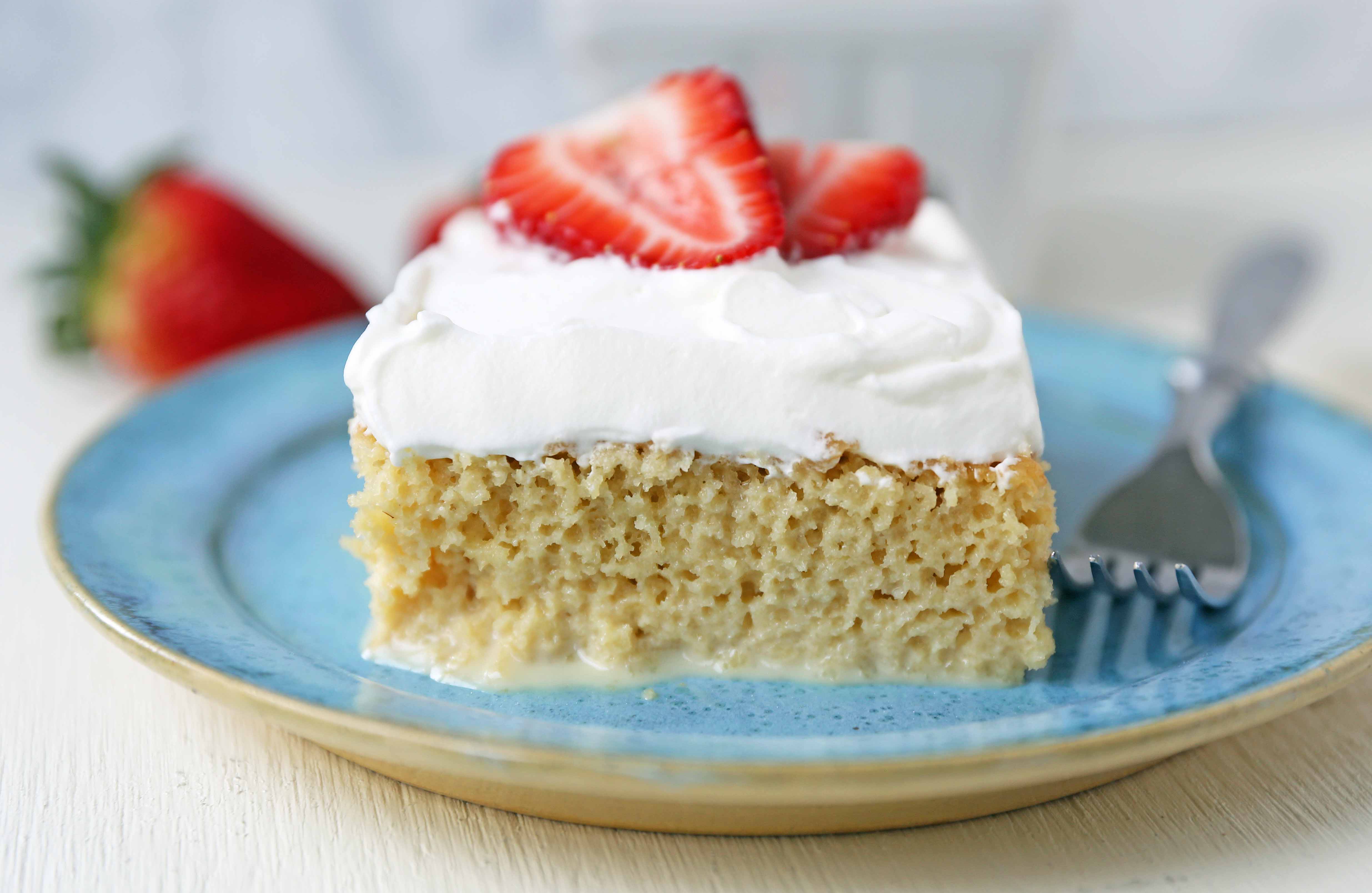 Tres Leches Cake. A classic Mexican dessert made with a vanilla sponge cake soaked with three kinds of milk -- heavy cream, evaporated milk and sweetened condensed milk and topped with whipped cream.  www.modernhoney.com #treslechescake #threemilkcake #cincodemayo