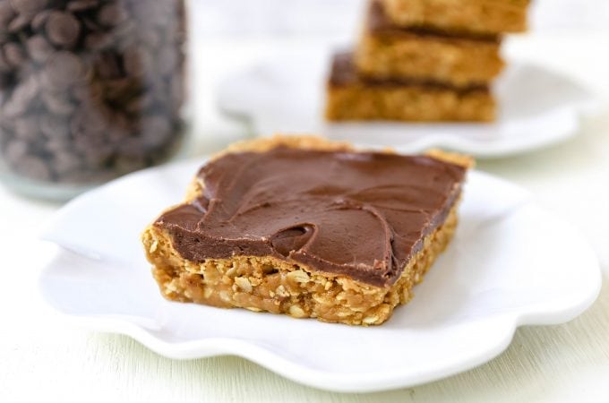 Chocolate Peanut Butter Cookie Bars Peanut Butter Oatmeal Cookie Bars with a Creamy Chocolate Frosting. A chocolate peanut butter lover's dream! Peanut Butter Fingers Recipe. www.modernhoney.com #chocolatepeanutbutter #peanutbutterbars #dessertbars