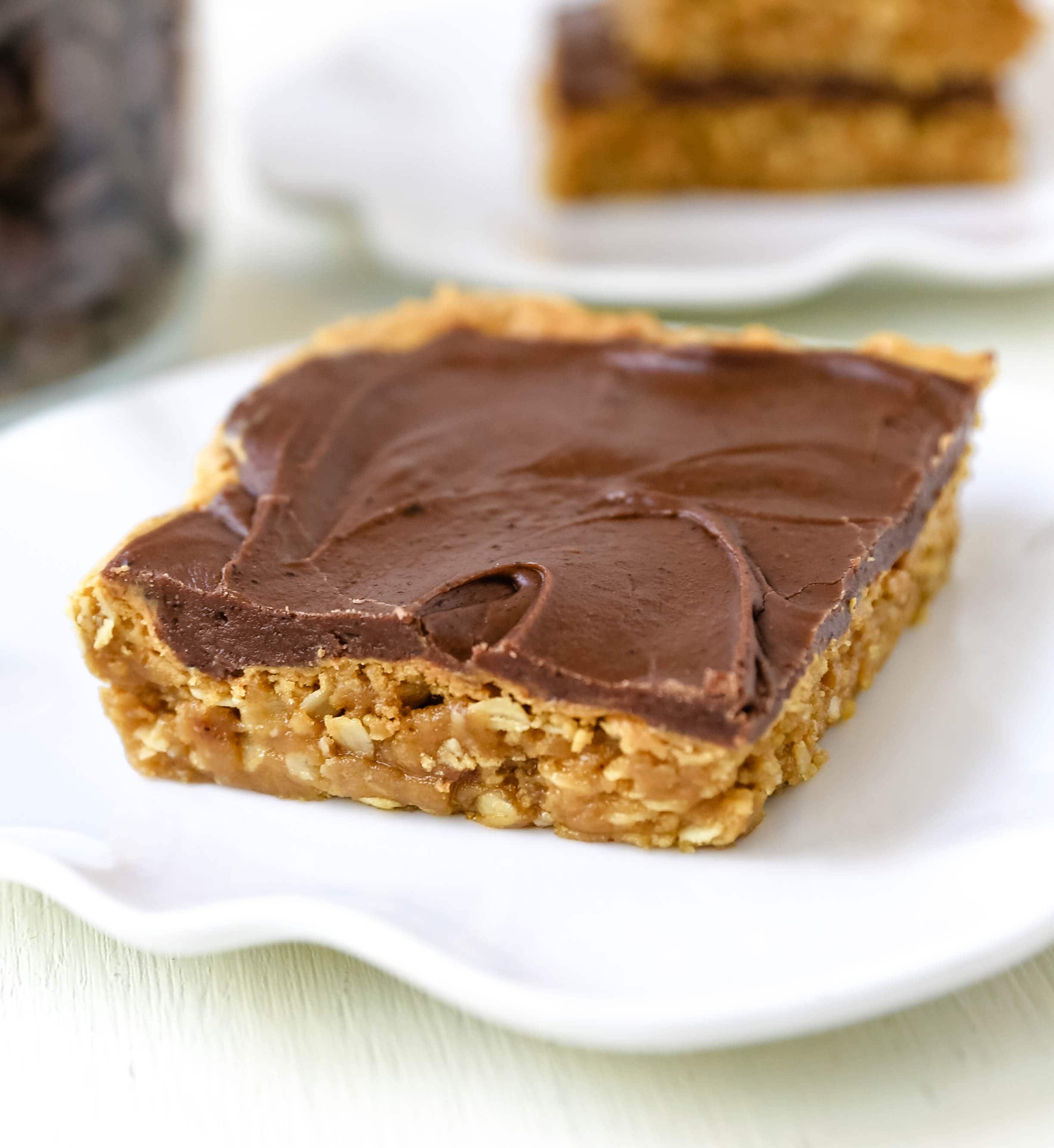 Chocolate Peanut Butter Cookie Bars Peanut Butter Oatmeal Cookie Bars with a Creamy Chocolate Frosting. A chocolate peanut butter lover's dream! Peanut Butter Fingers Recipe. www.modernhoney.com #chocolatepeanutbutter #peanutbutterbars #dessertbars