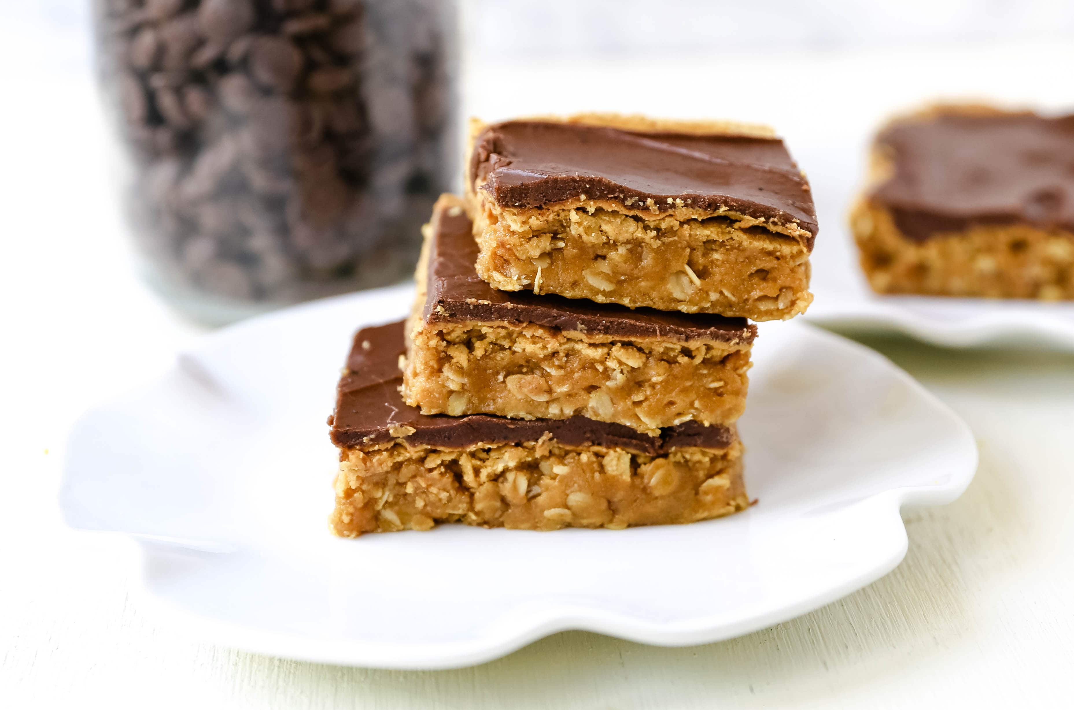 Chocolate Peanut Butter Cookie Bars Peanut Butter Oatmeal Cookie Bars with a Creamy Chocolate Frosting. A chocolate peanut butter lover's dream! Peanut Butter Fingers Recipe. www.modernhoney.com #chocolatepeanutbutter #peanutbutterbars #dessertbars