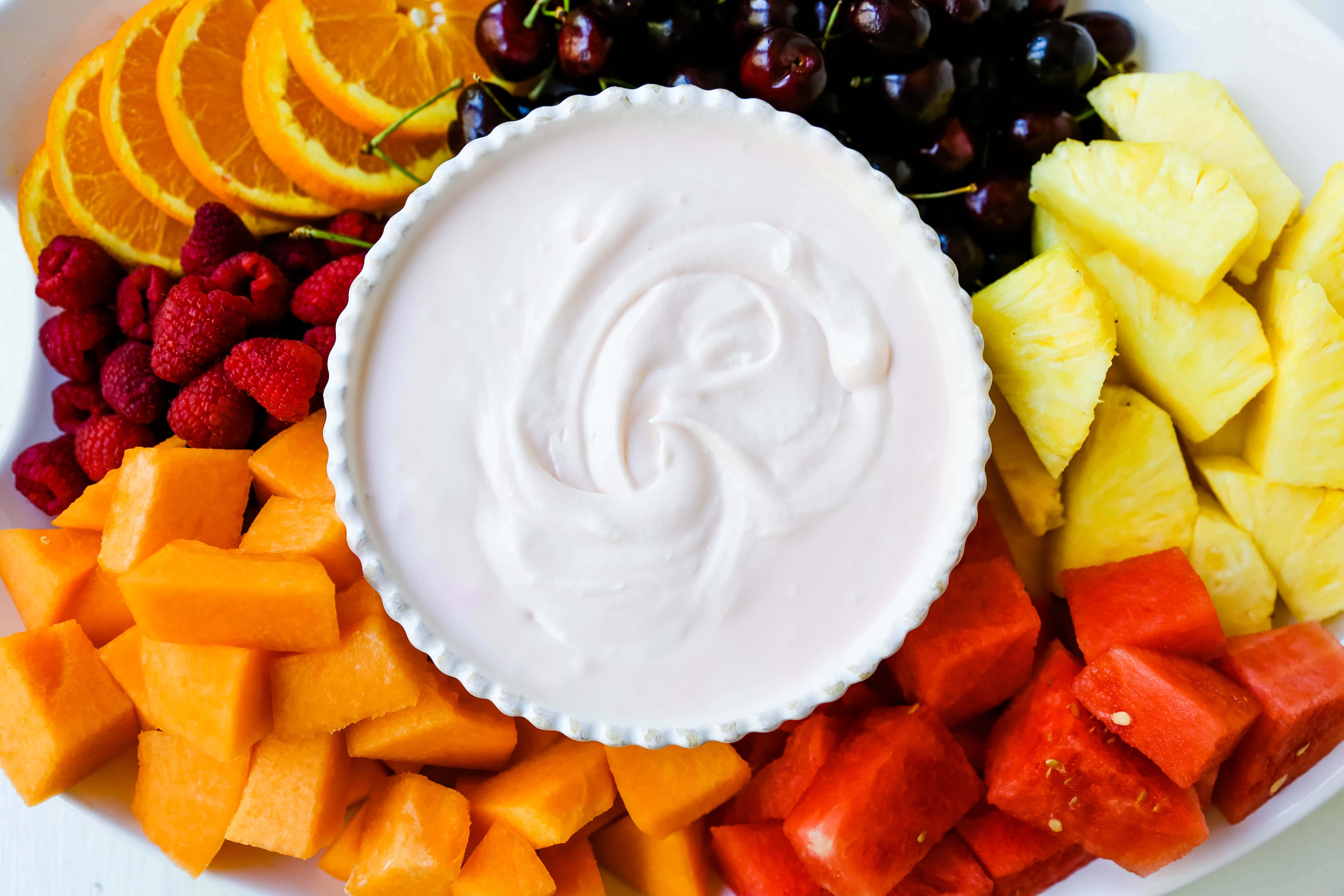 Fruit Dip Creamy, fluffy fruit dip made with cream cheese, sweetened condensed milk, homemade whipped cream, and a touch of cherry juice. The best fruit dip recipe! www.modernhoney.com #fruitdip #creamyfruitdip #creamcheesedip