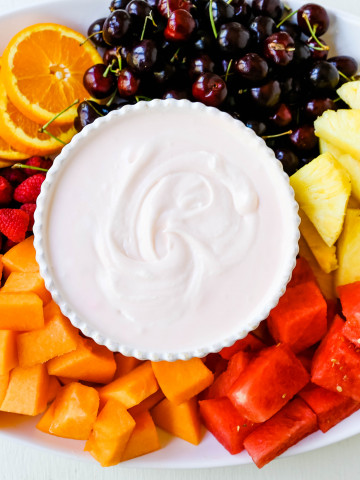 Fruit Dip Creamy, fluffy fruit dip made with cream cheese, sweetened condensed milk, homemade whipped cream, and a touch of cherry juice. The best fruit dip recipe! www.modernhoney.com #fruitdip #creamyfruitdip #creamcheesedip